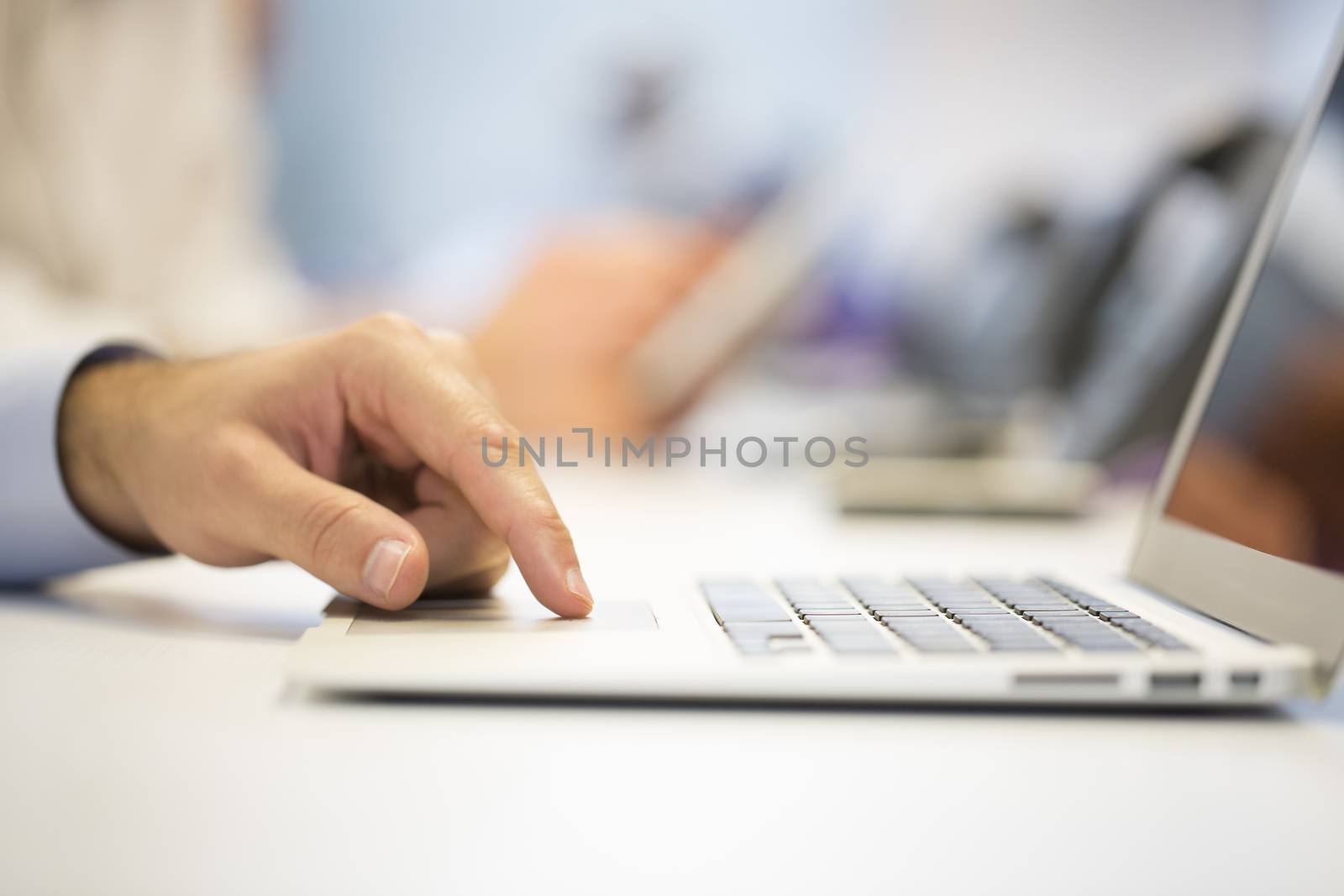 Close-up of  businessman hands typing on laptop, Office Backgrou by LDProd