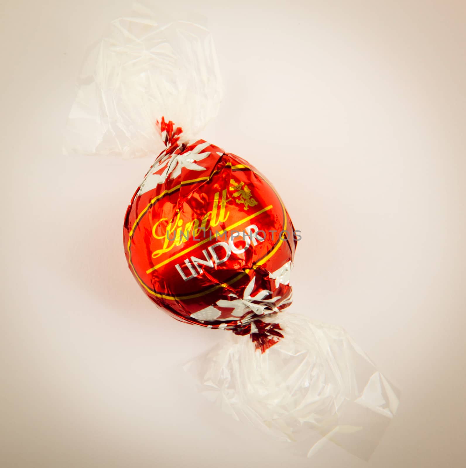 AYTOS, BULGARIA - APRIL 02, 2014: Milk Chocolate LINDOR truffle. Lindt & Spr��ngli is recognized as a leader in the market for premium quality chocolate.