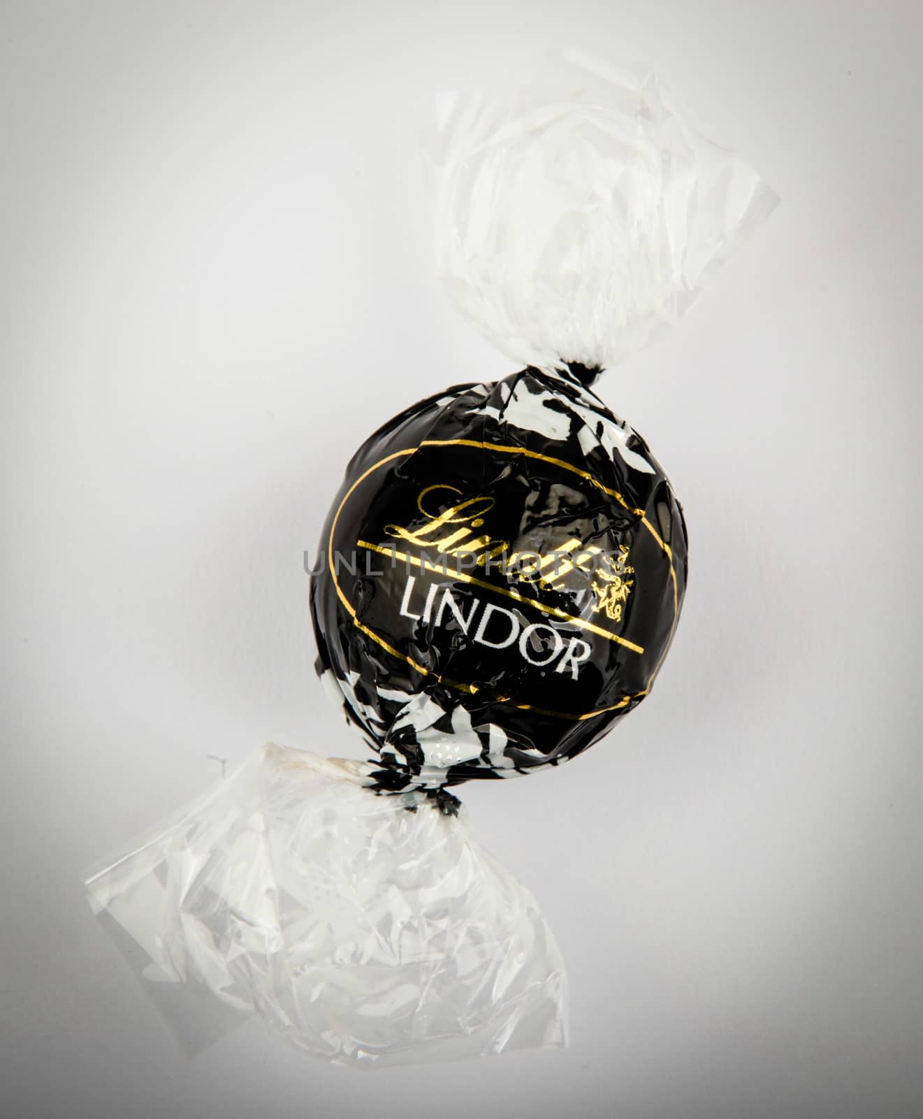 AYTOS, BULGARIA - APRIL 02, 2014: Milk Chocolate LINDOR truffle. Lindt & Spr��ngli is recognized as a leader in the market for premium quality chocolate.