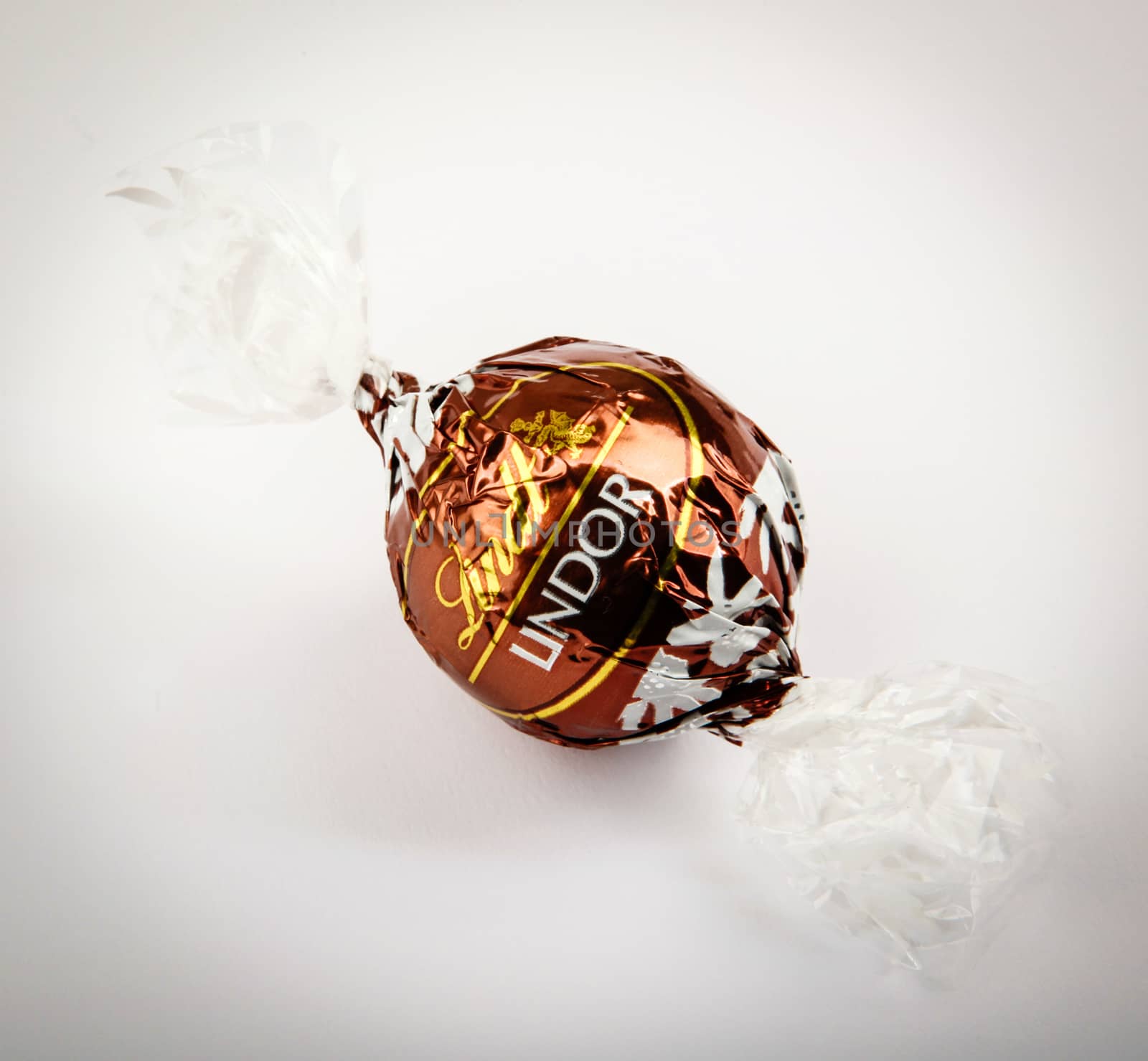 AYTOS, BULGARIA - APRIL 02, 2014: Milk Chocolate LINDOR truffle. Lindt & Spr��ngli is recognized as a leader in the market for premium quality chocolate.
