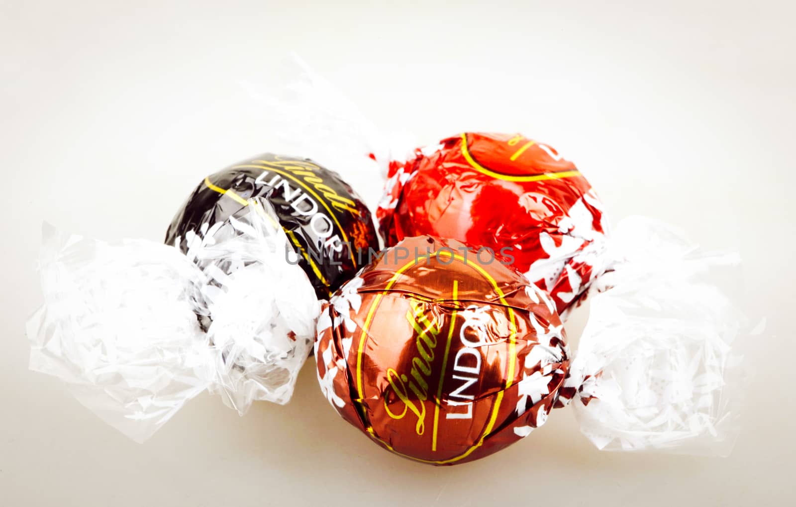 AYTOS, BULGARIA - APRIL 02, 2014: Milk Chocolate LINDOR truffle. Lindt & Spr��ngli is recognized as a leader in the market for premium quality chocolate.