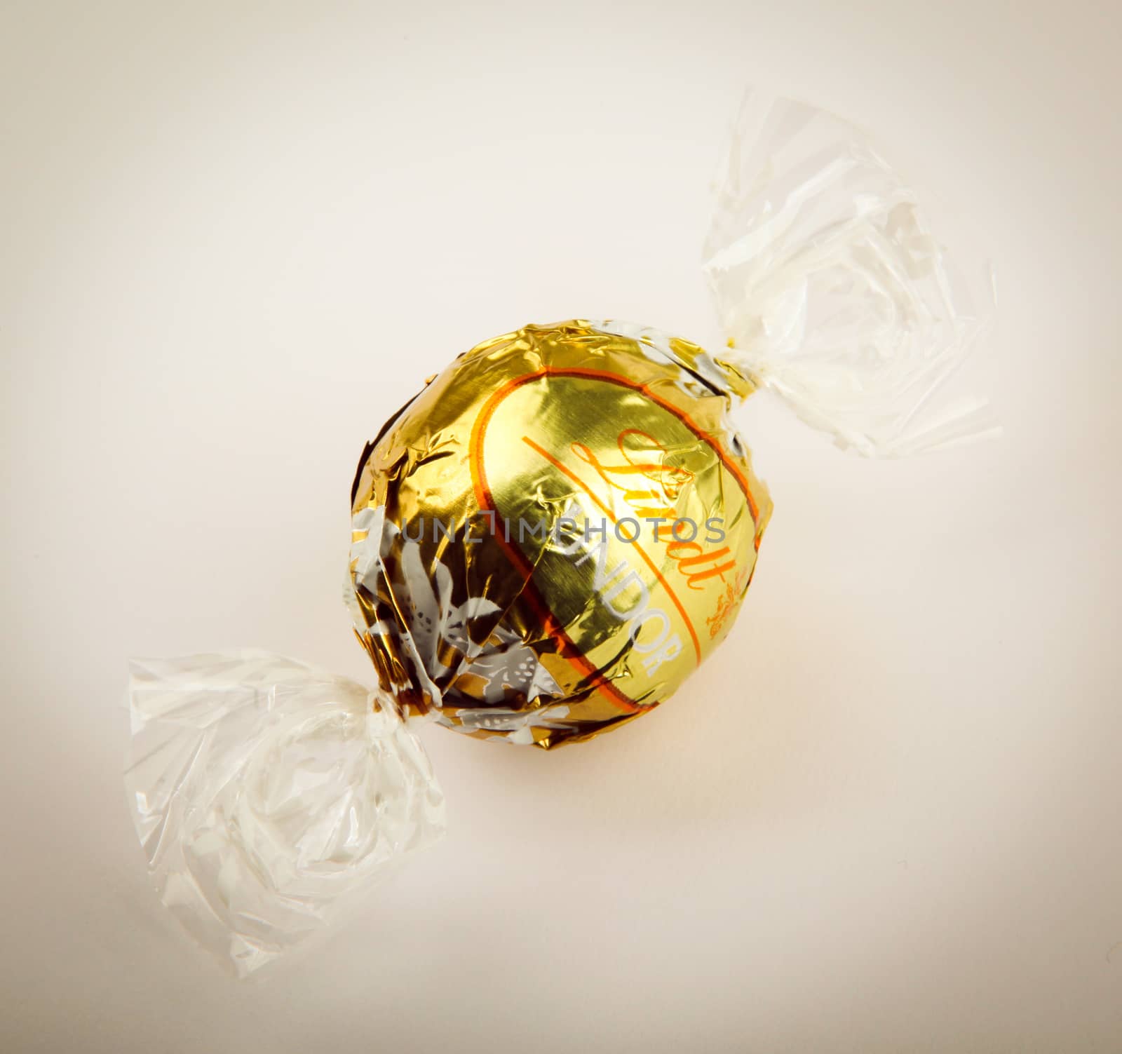 AYTOS, BULGARIA - APRIL 02, 2014: Milk Chocolate LINDOR truffle. Lindt & Spr��ngli is recognized as a leader in the market for premium quality chocolate.