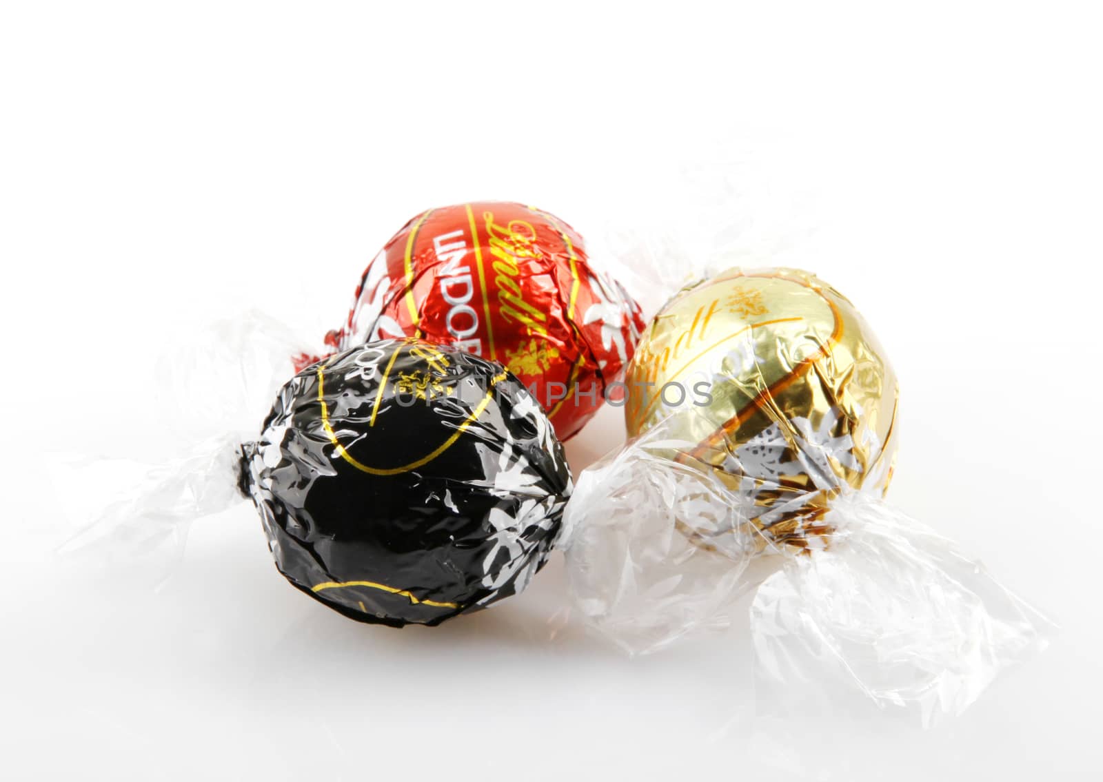 AYTOS, BULGARIA - APRIL 02, 2014: Milk Chocolate LINDOR truffle. Lindt & Spr��ngli is recognized as a leader in the market for premium quality chocolate.