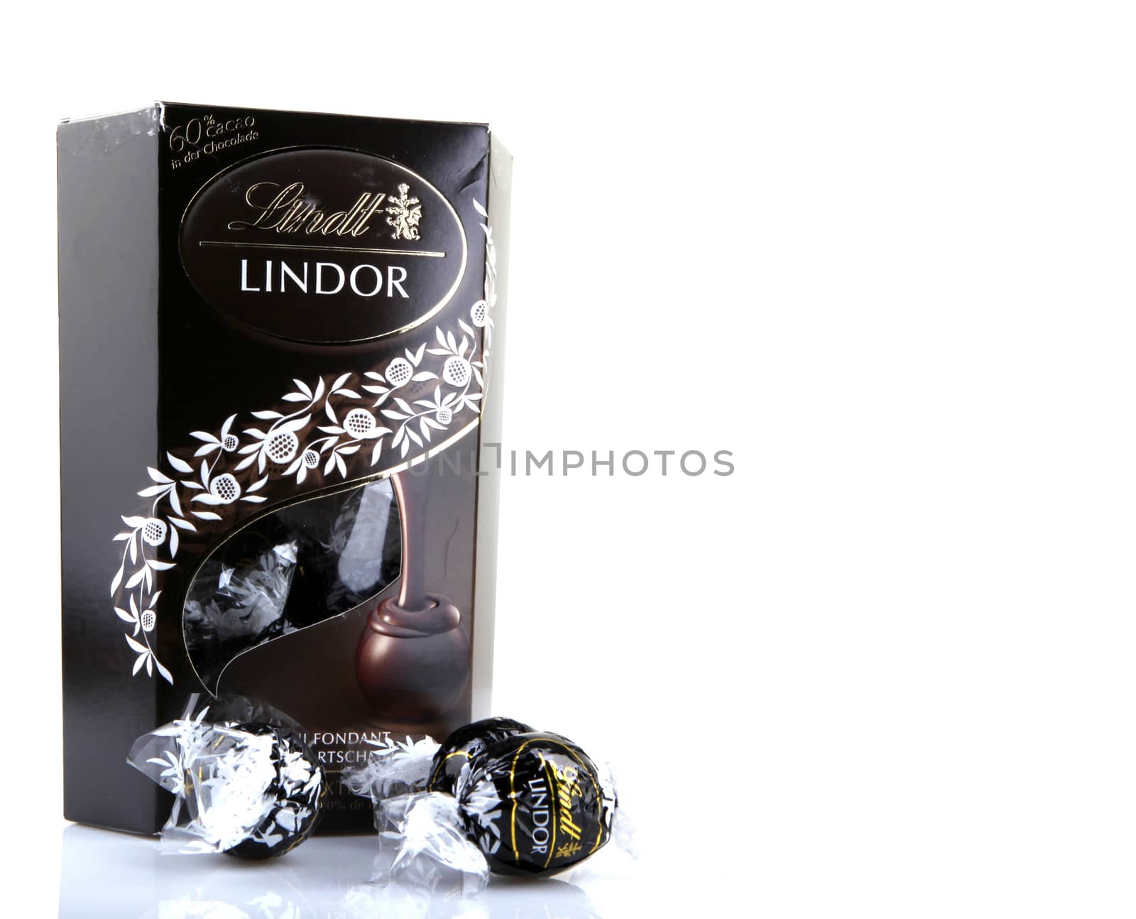 AYTOS, BULGARIA - APRIL 02, 2014: Milk Chocolate LINDOR truffle. Lindt & Spr��ngli is recognized as a leader in the market for premium quality chocolate.