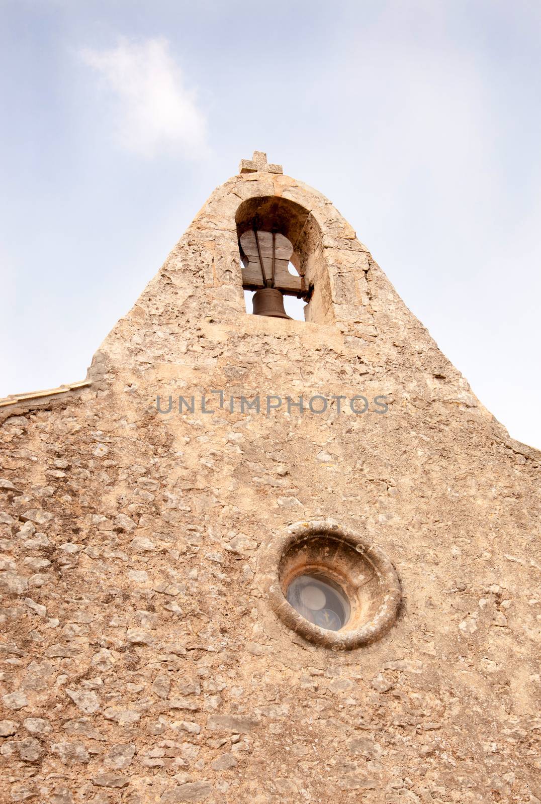 Campanile with belfry at the monastery Santuari de Cura in Randa, Majorca. by ArtesiaWells