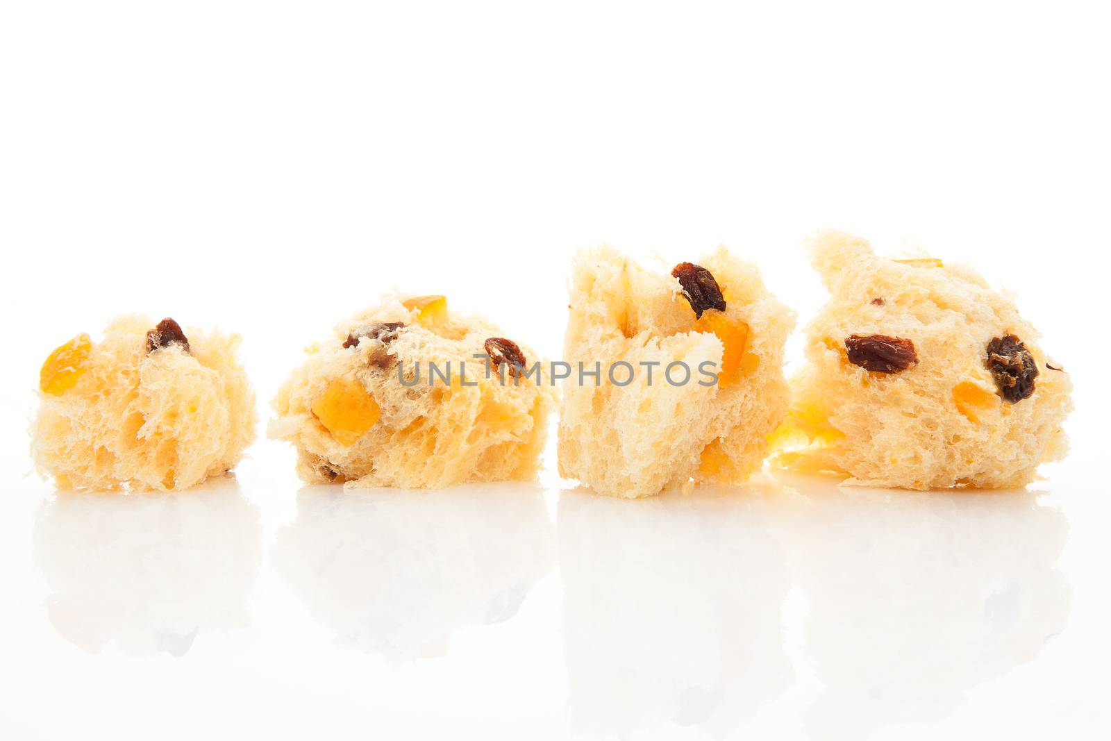 Luxurious panettone pieces isolated on white background. Festive food background.