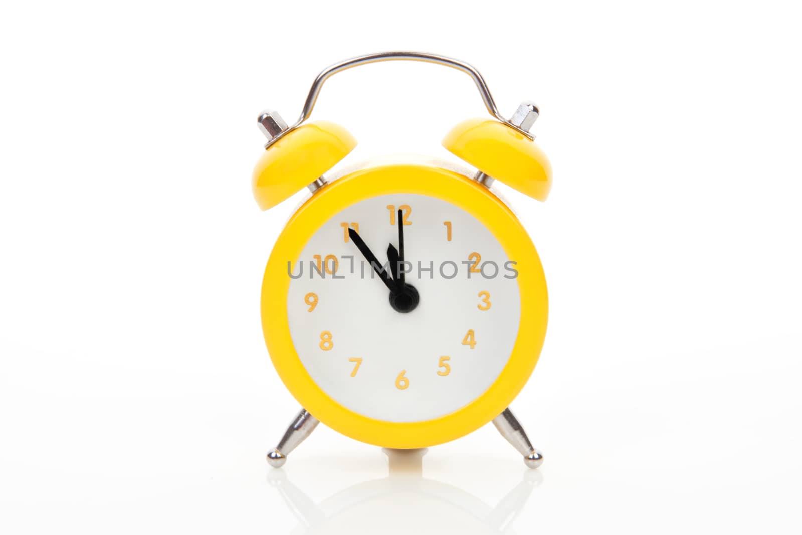 Yellow alarm clock isolated on white background. Just in time concept.