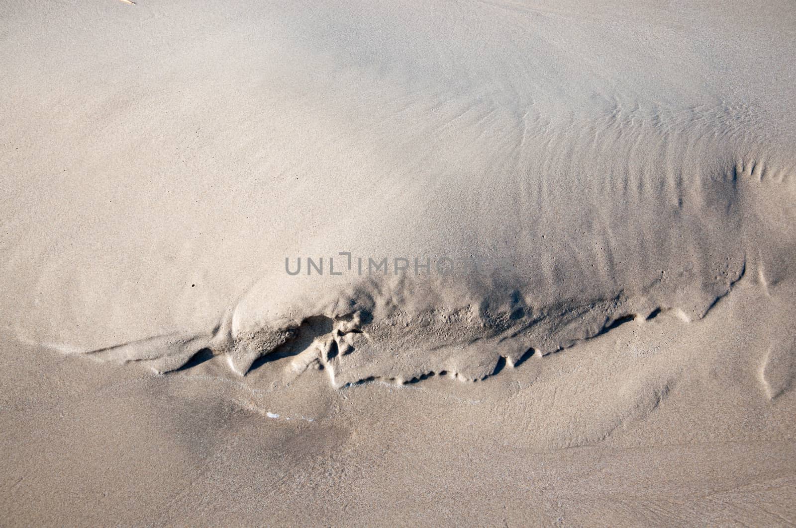 Small natural sand shape on a beach.