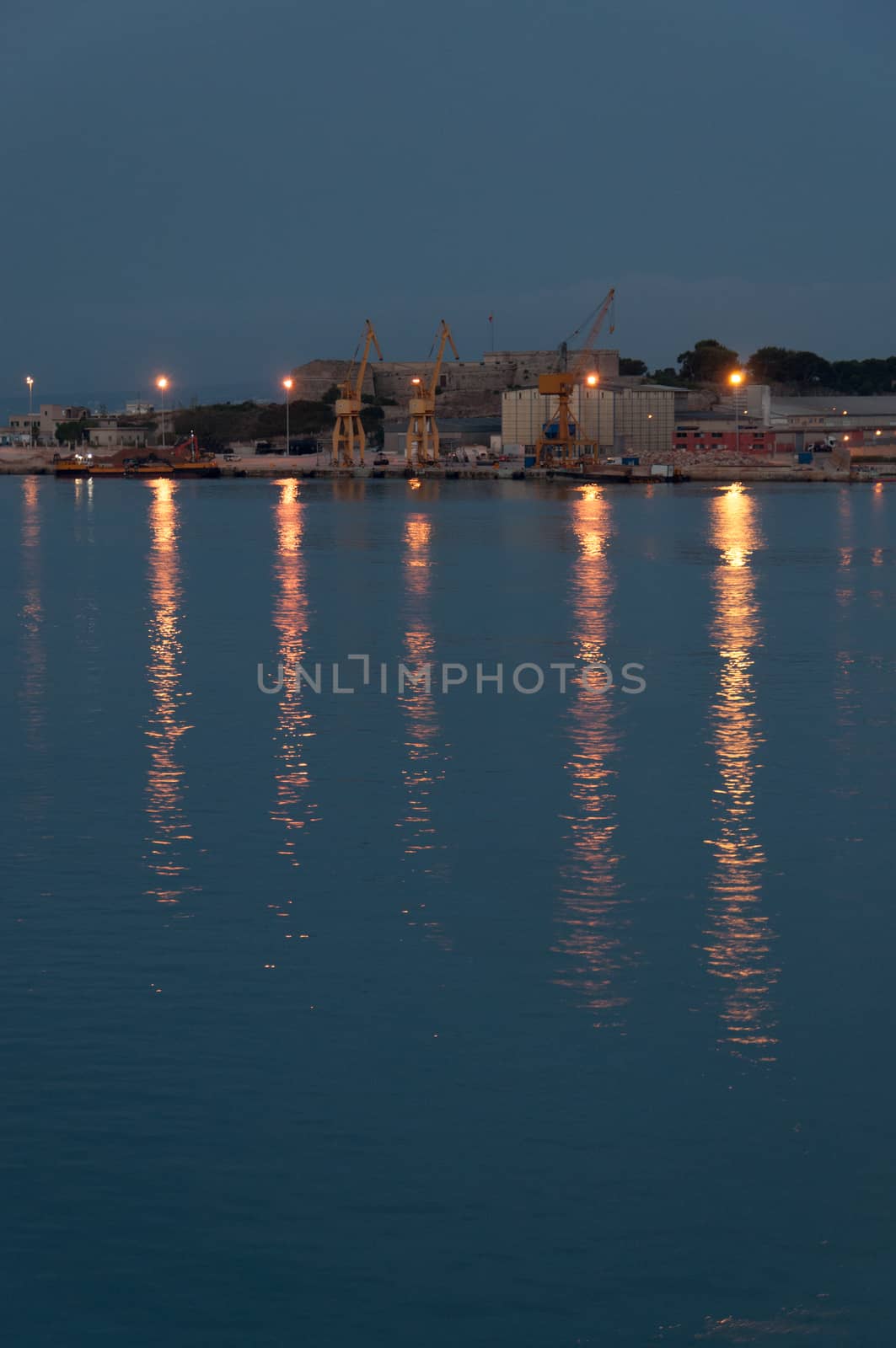Light reflections from industrial area at daybreak by ArtesiaWells