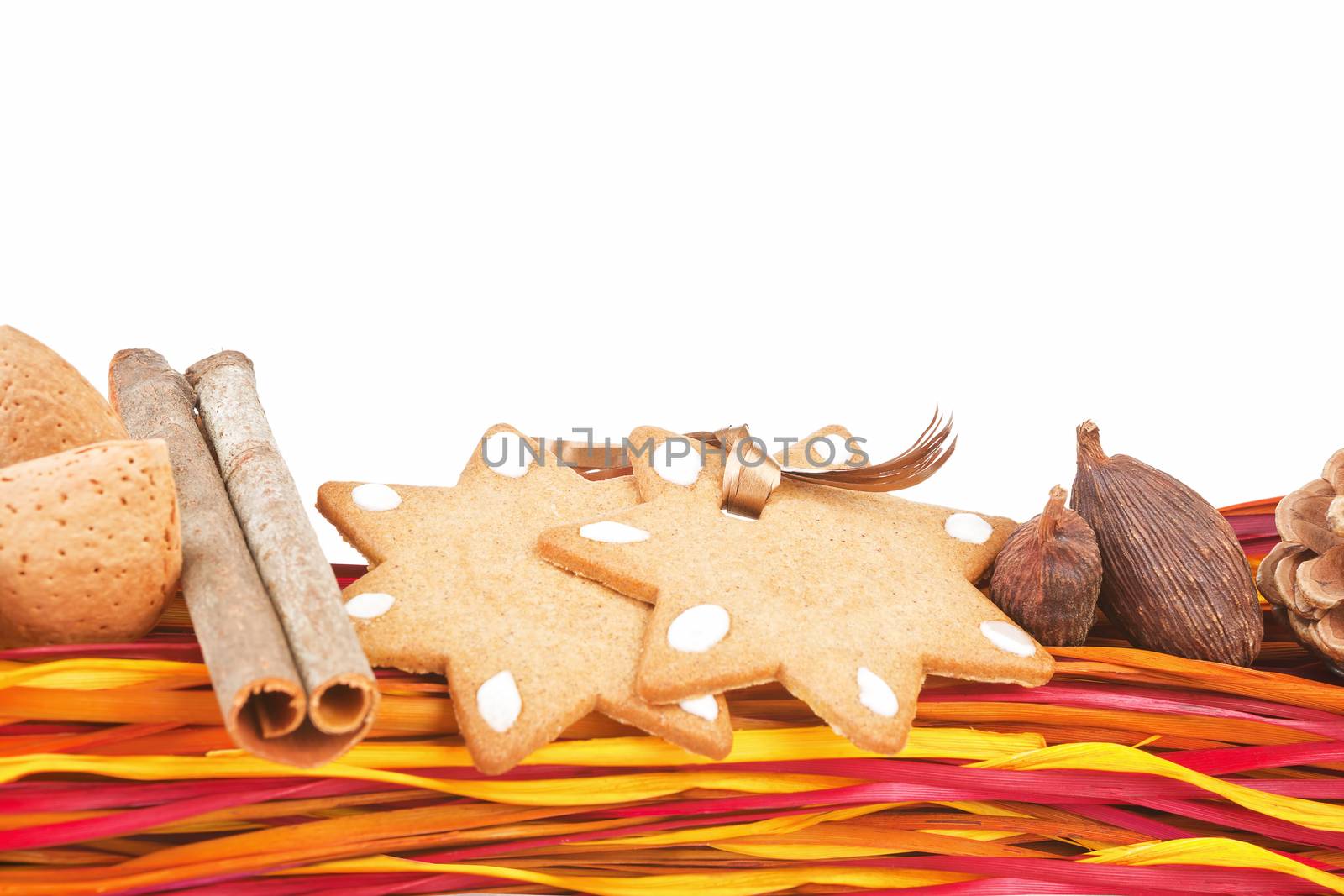 Colorful christmas still life with gingerbread, cinnamon, nutmeg, almond and copy space. Temporary christmas concept.