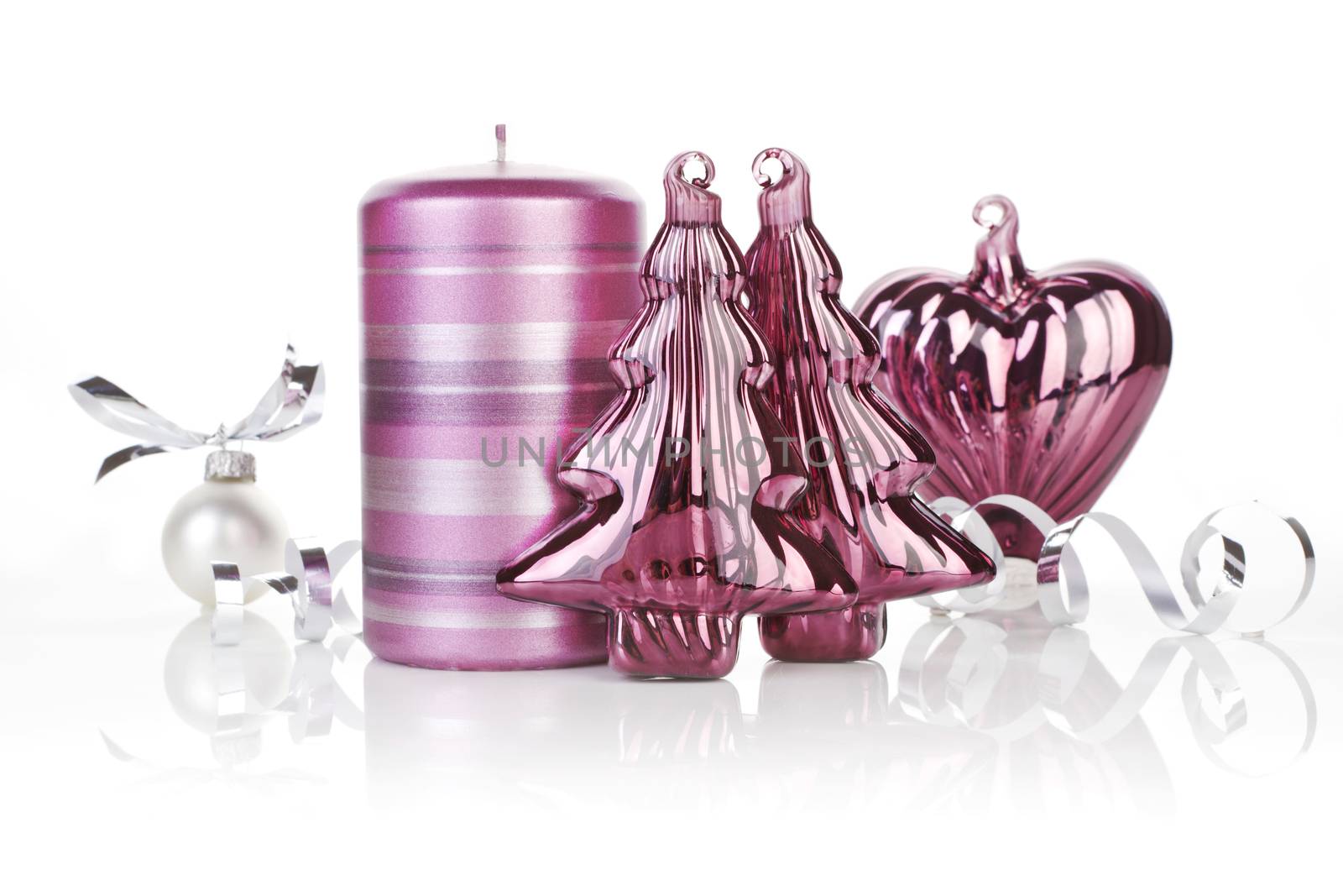 Purple shiny christmas still life with candle, and xmas decoration. Temporary christmas design concept.