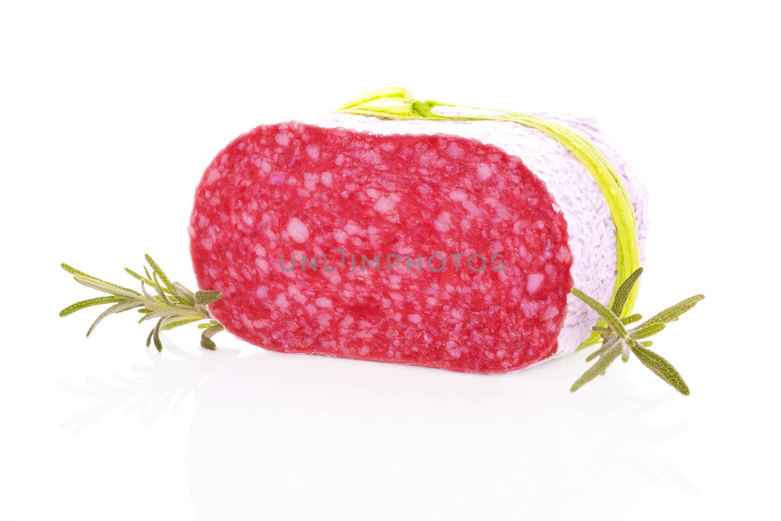 Luxurious salami piece with fresh rosemary isolated on white background.