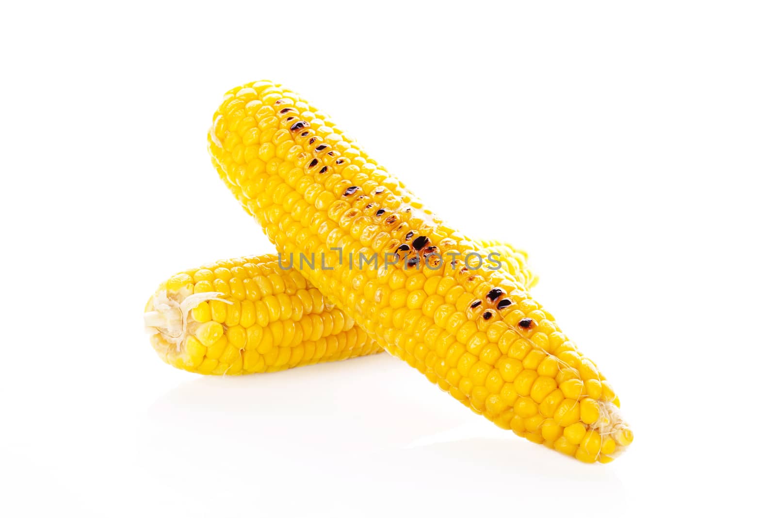 Boiled and roasted corn isolated on white background. Culinary vegetarian eating.