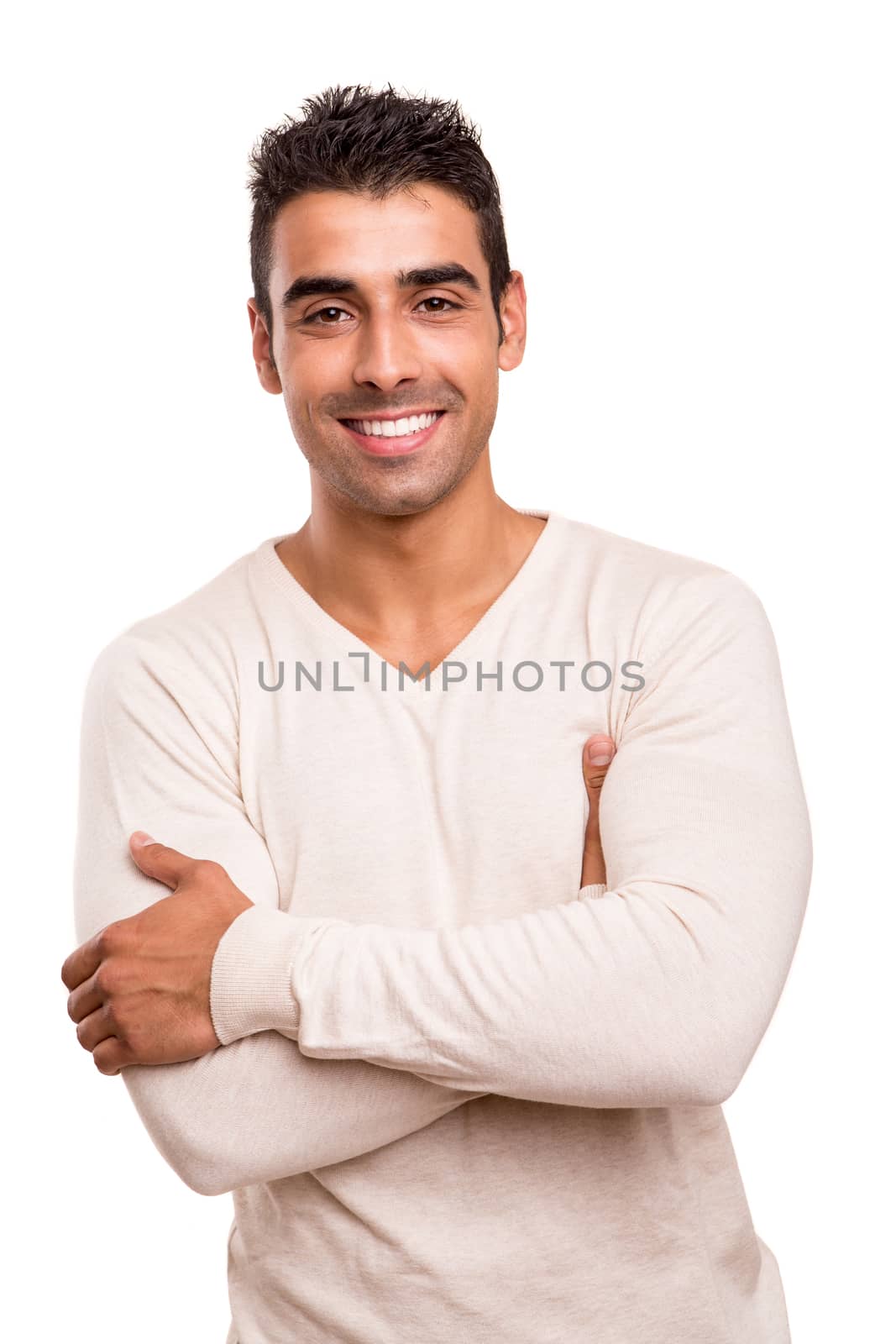 Casual young man with arms crossed and smiling