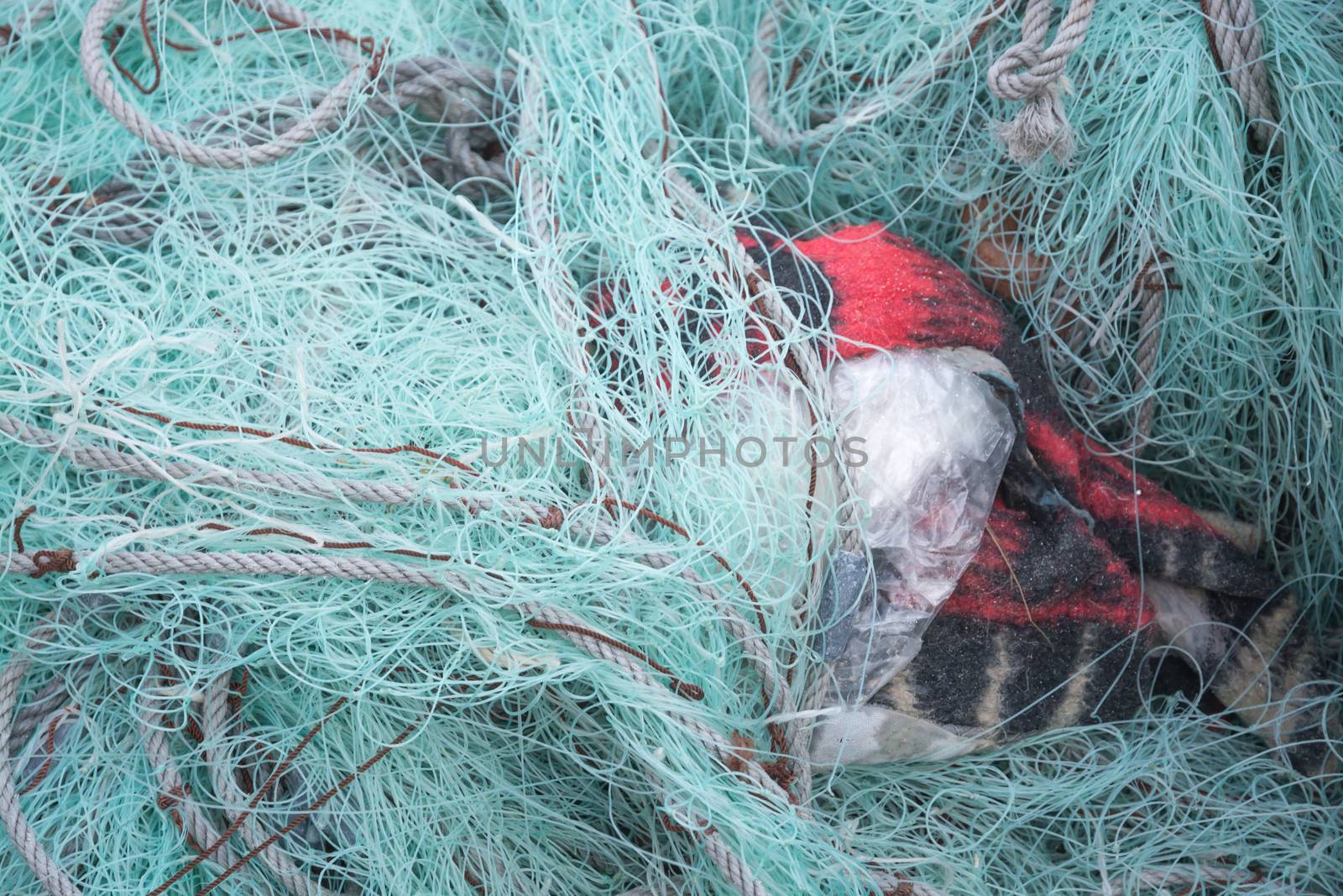 Mint green fishing nets and red details.