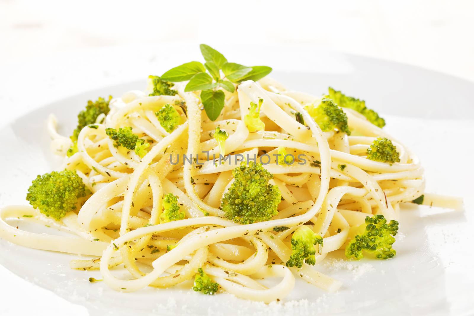 Traditional spaghetti carbonara with broccoli close up. Italian cuisine.