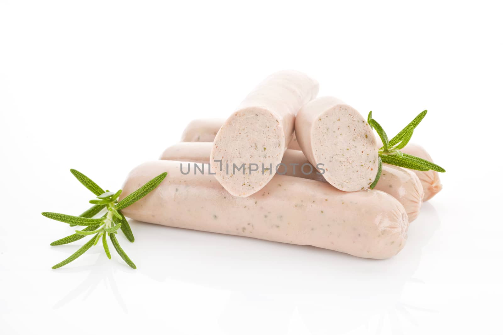 Several white barbeque sausages isolated on white with fresh rosemary.