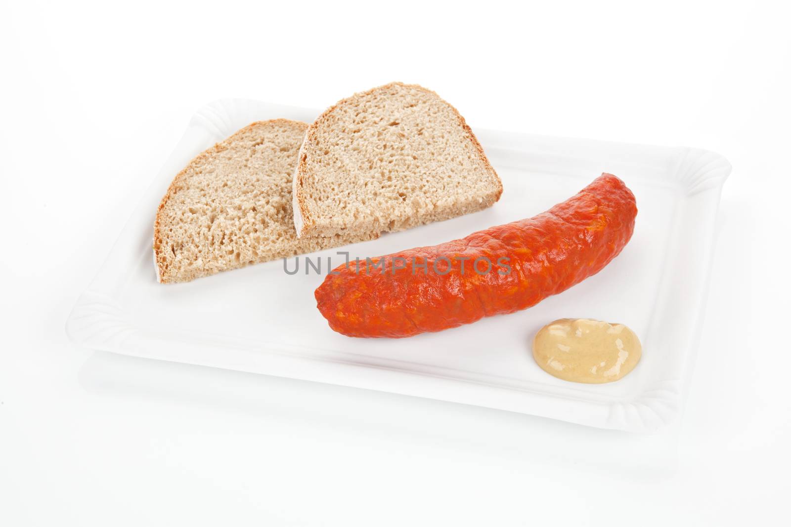 Delicious sausage with bread and mustard on white plate. Fast food concept.