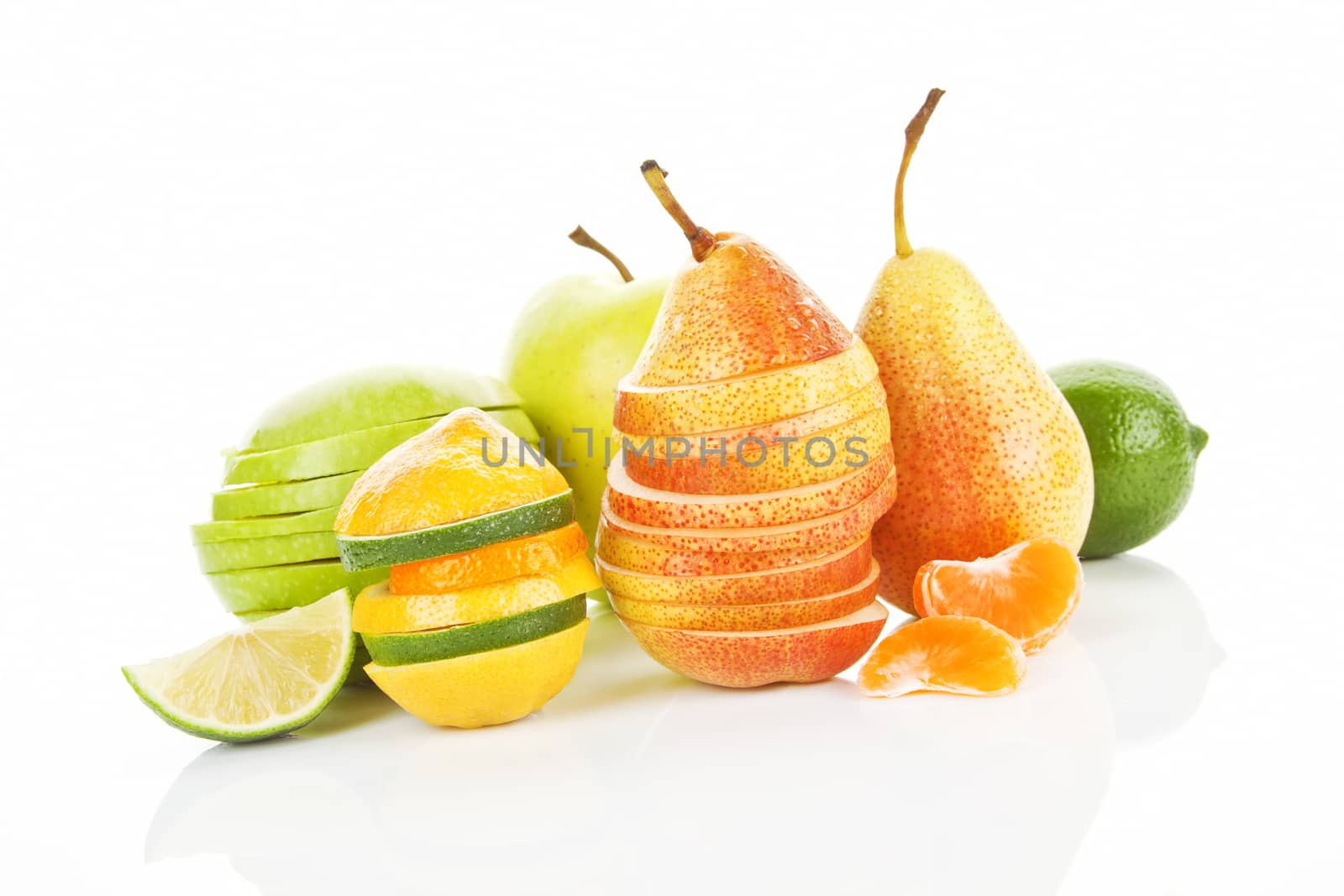 Colorful summer background. Apple, pear, lime and tangerine pieces, slices and whole fruit isolated.