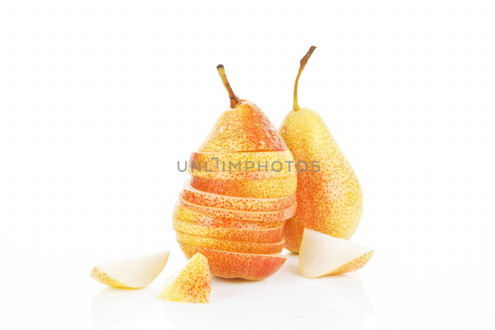 Ripe pear background. Slices, pieces and whole pears isolated on white.
