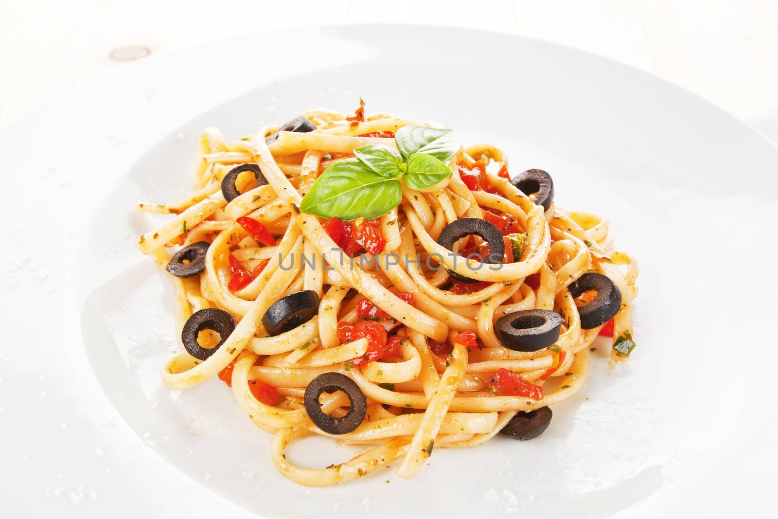 Pasta with tomato sauce and olives. by eskymaks