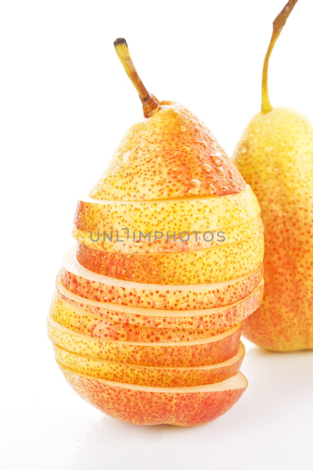 Fresh ripe pear in slices close up. Healthy fruit background.
