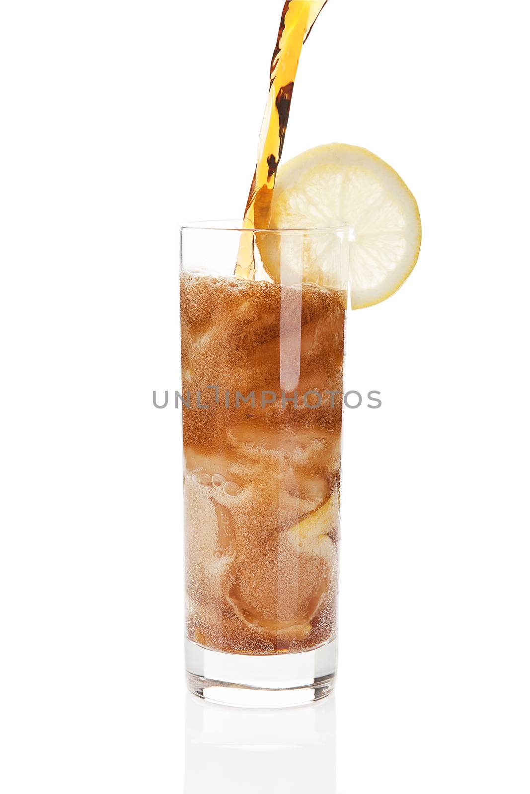 Pouring coke into a glass isolated on white background with clipping path. 