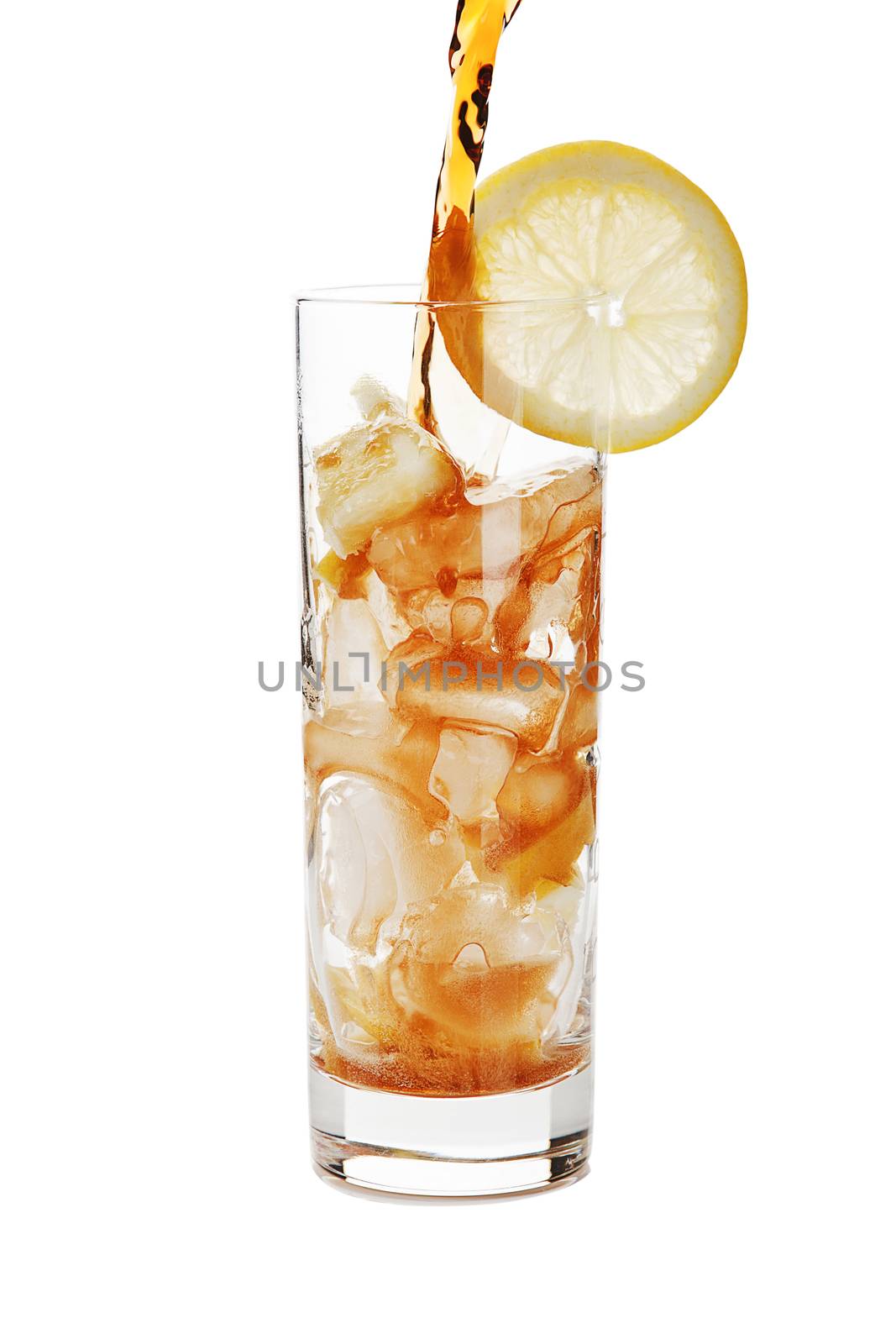 Pouring cola into a glass with ice isolated on white background.
