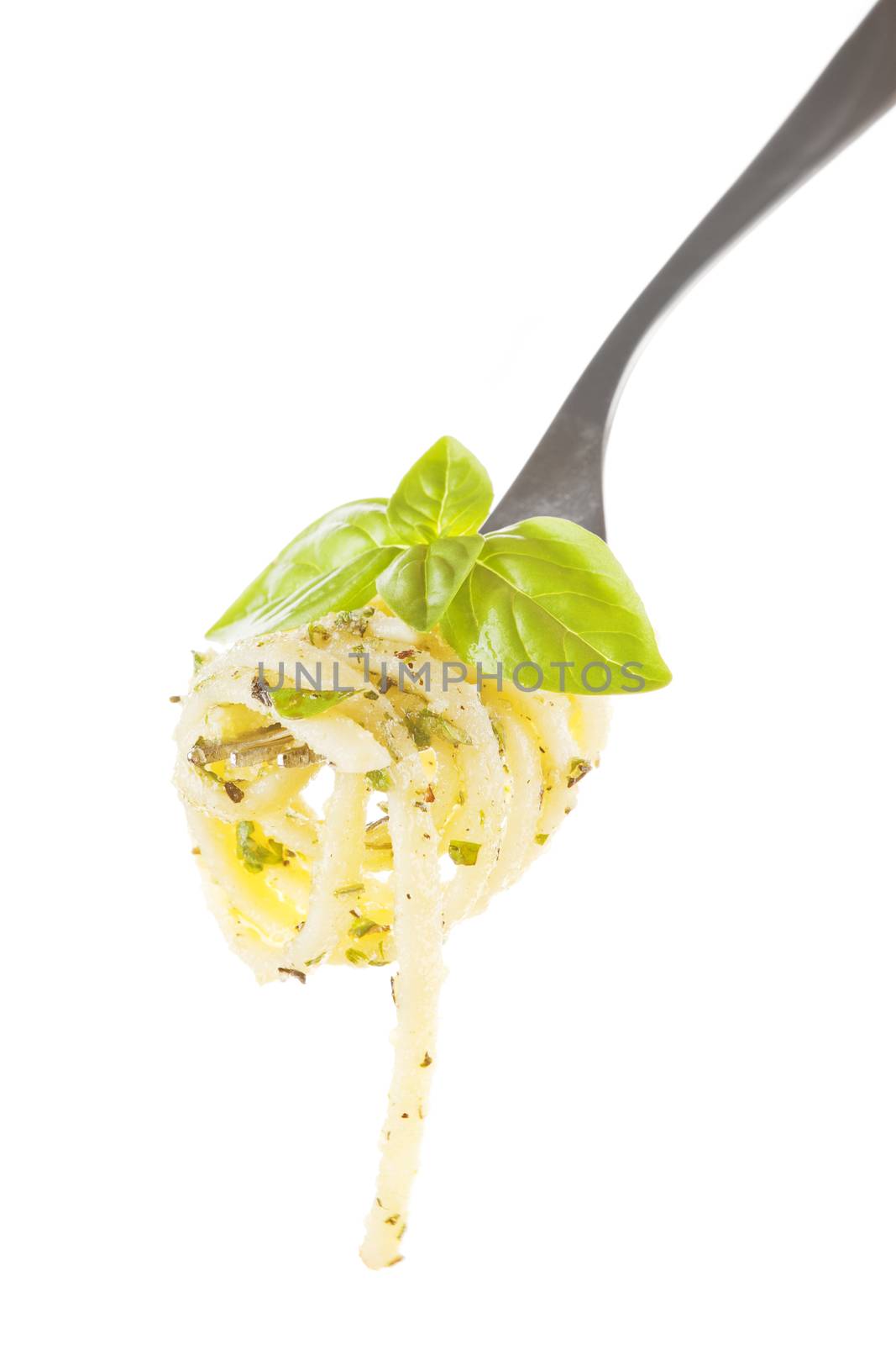  Noodle with pesto and fresh basil on fork isolated on white background. 
