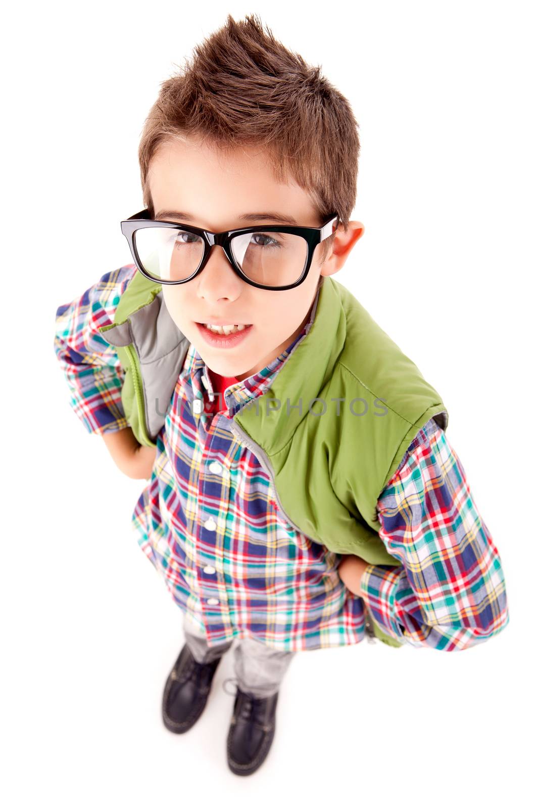 Smiling little boy posing over white background