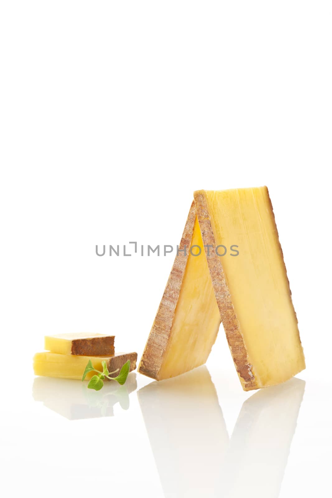 Luxurious cheese arranged on white background.