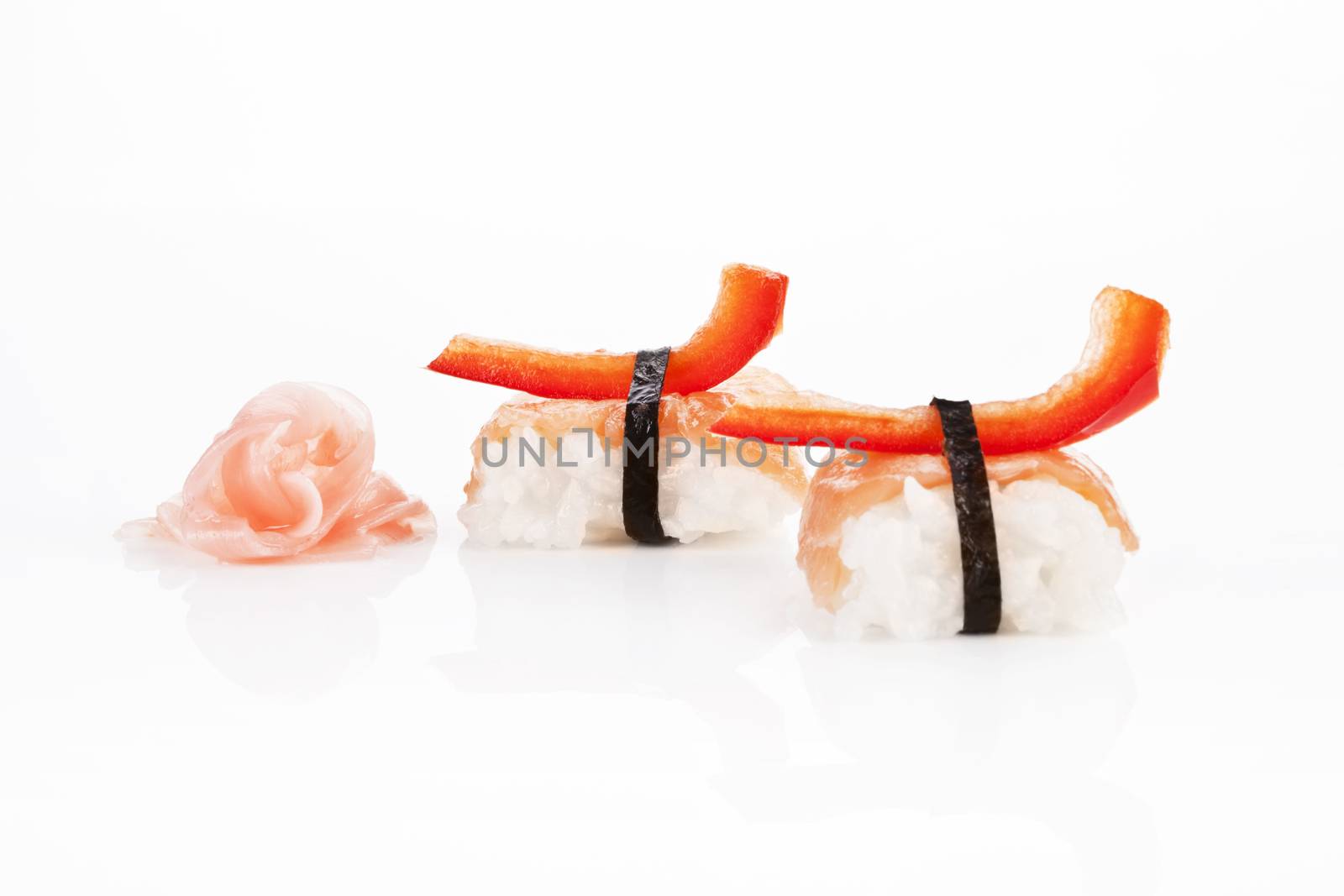 Nigiri sushi with salmon and ginger isolated on white background.