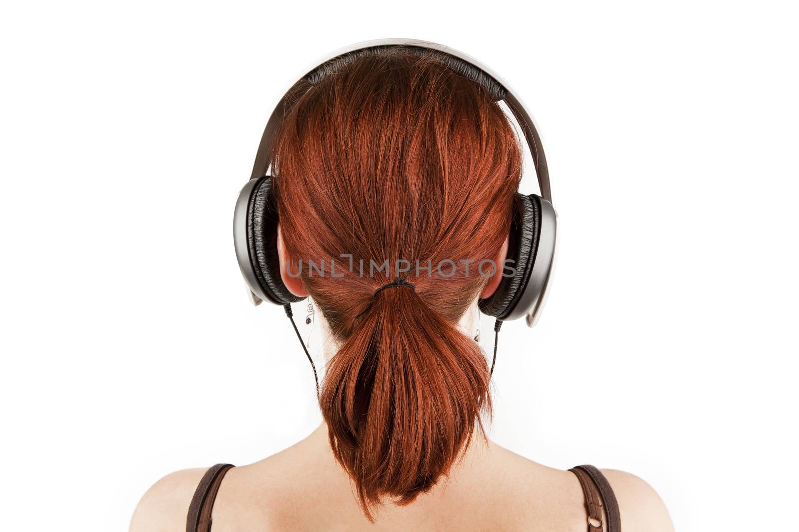 Girl with red hair listening to music. by eskymaks