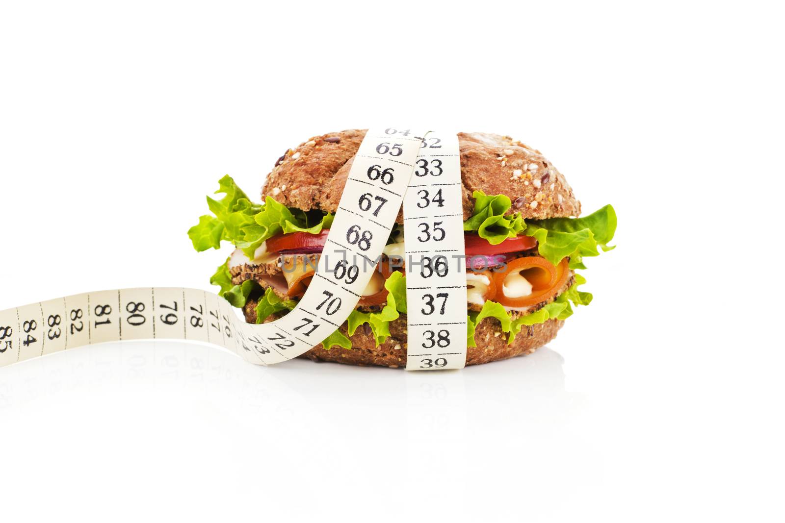 Healthy sandwich with fresh vegetables and cheese and measuring tape isolated on white. Fitness concept.