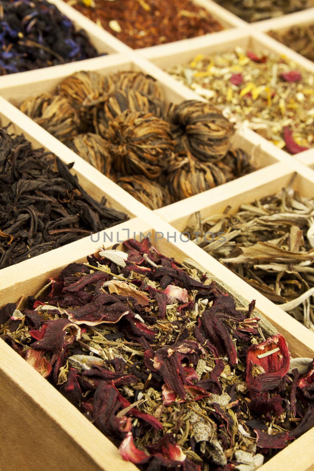 Organic natural tea collection in wooden box, black tea, green tea, fruit tea. 