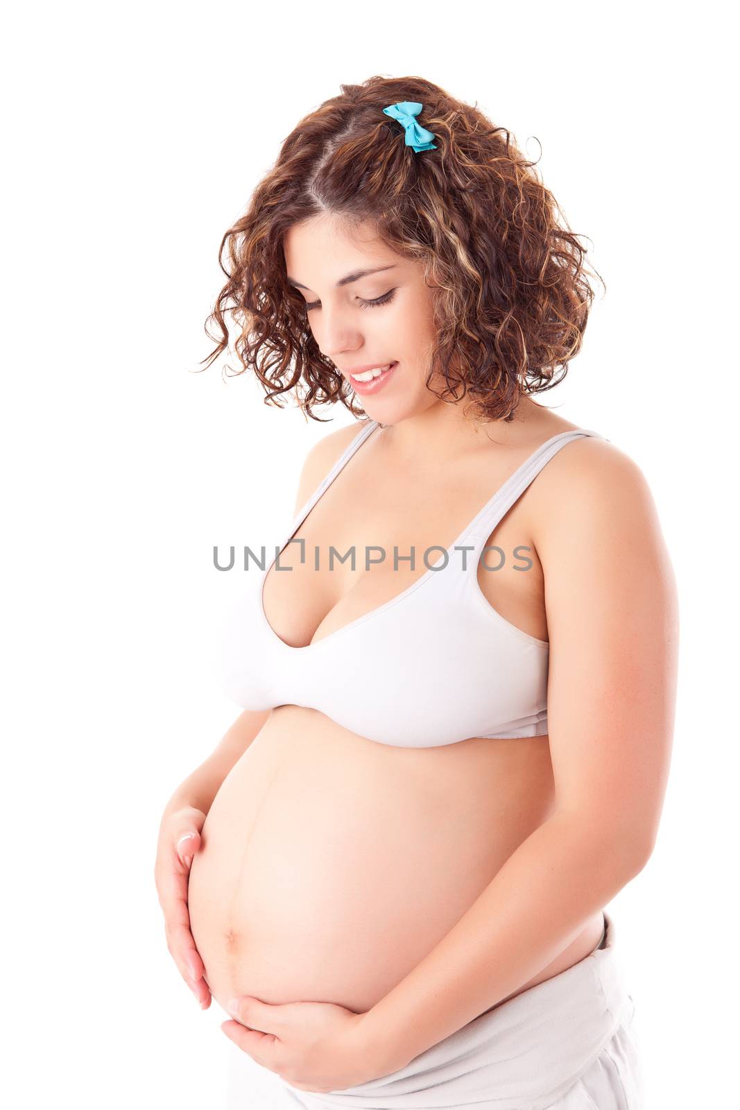 Beautiful pregnant woman showing her good shape over white background