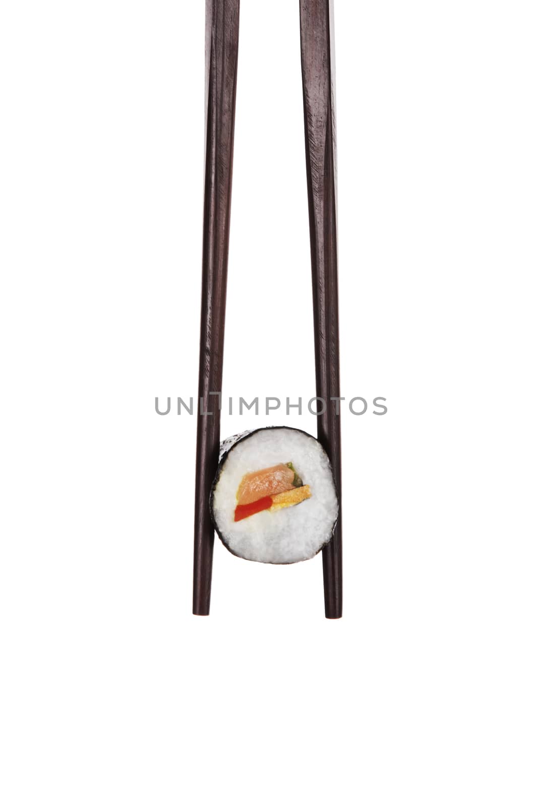 Sushi. Holding maki sushi with chopsticks isolated on white background.