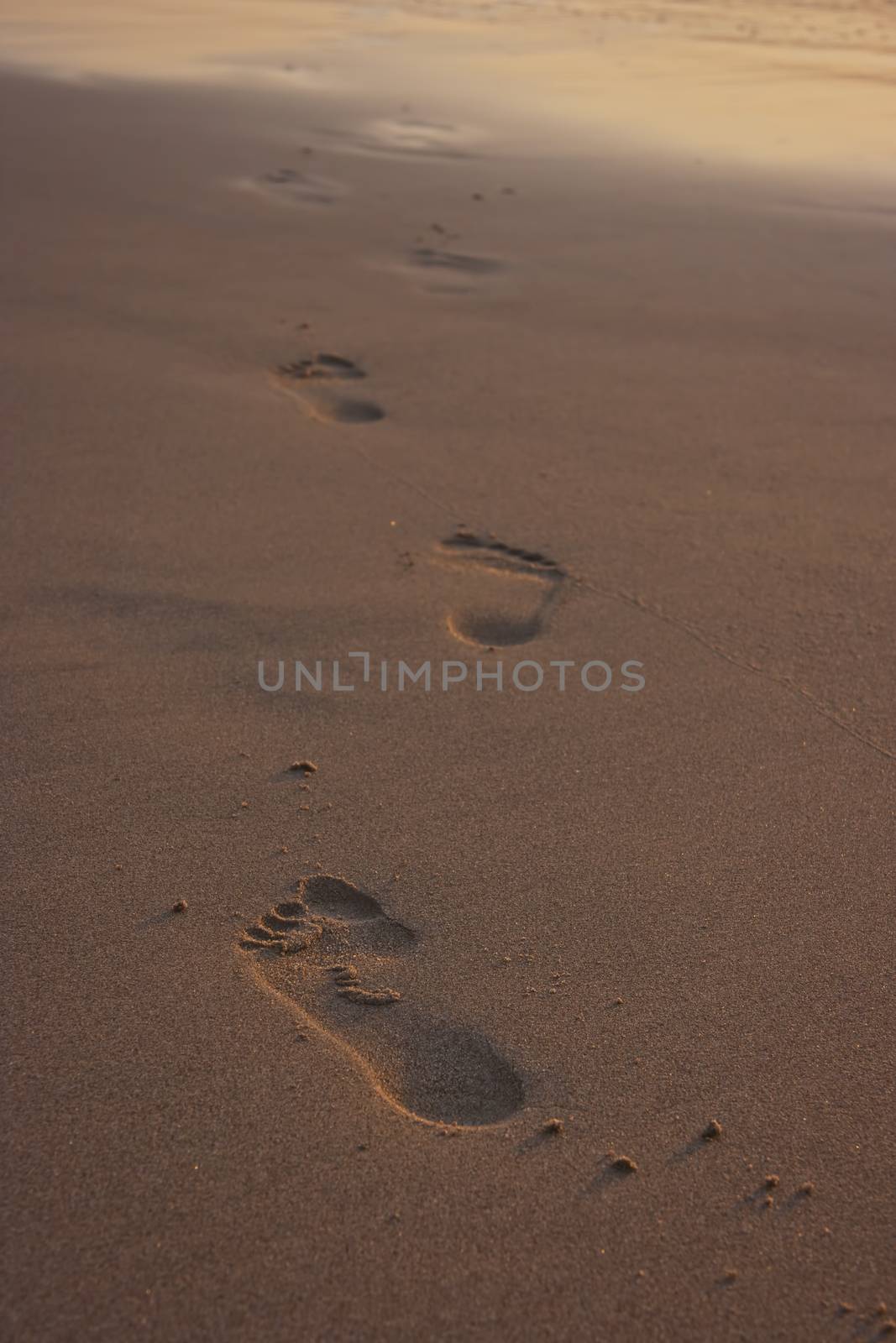 Footprints on beach. by eskymaks