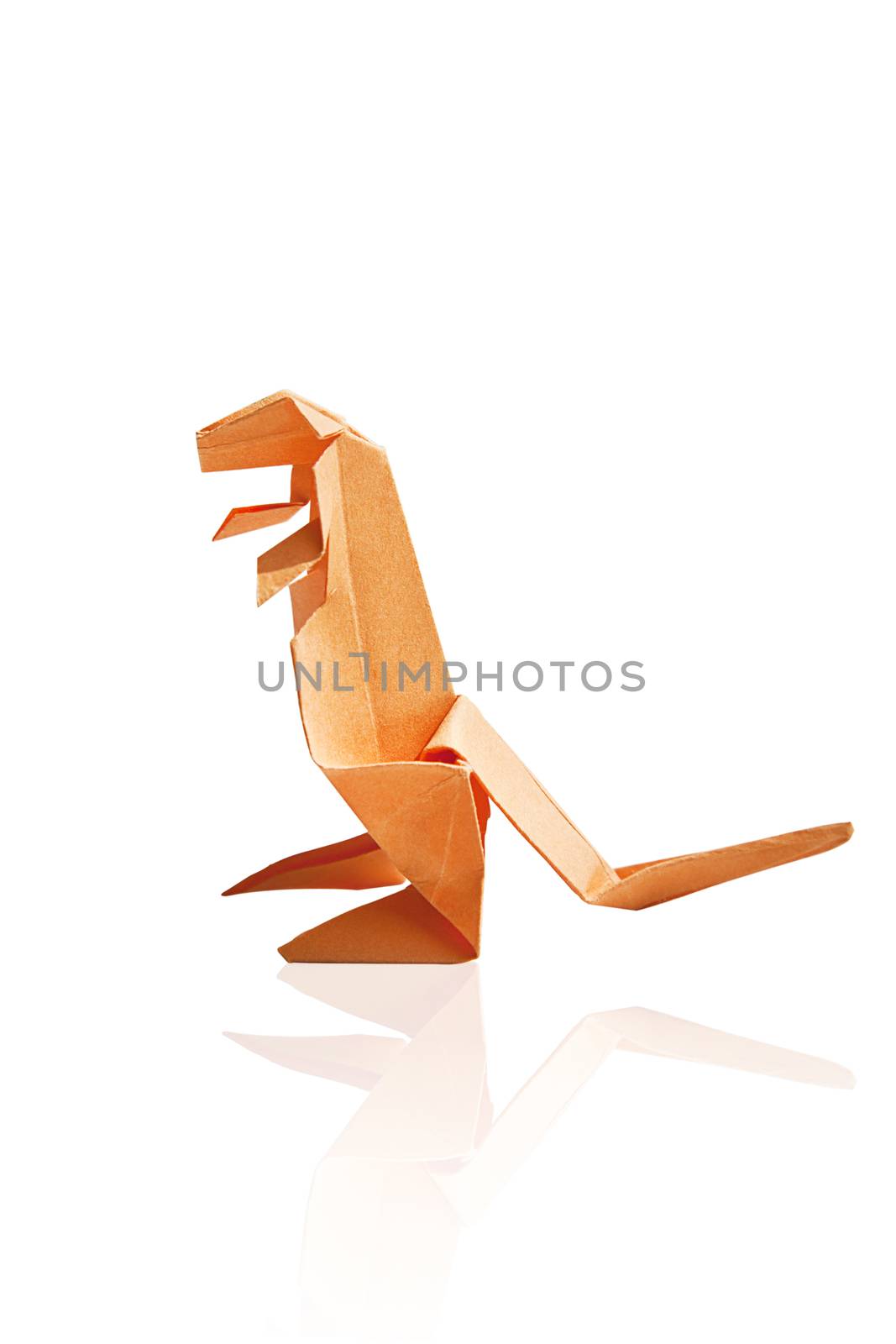 Orange origami dinosaur isolated on white background.