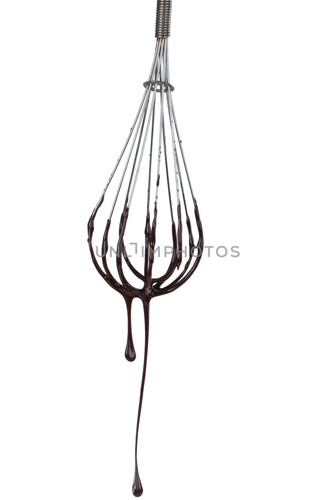 Delicious chocolate dropping from whisk isolated on white background.