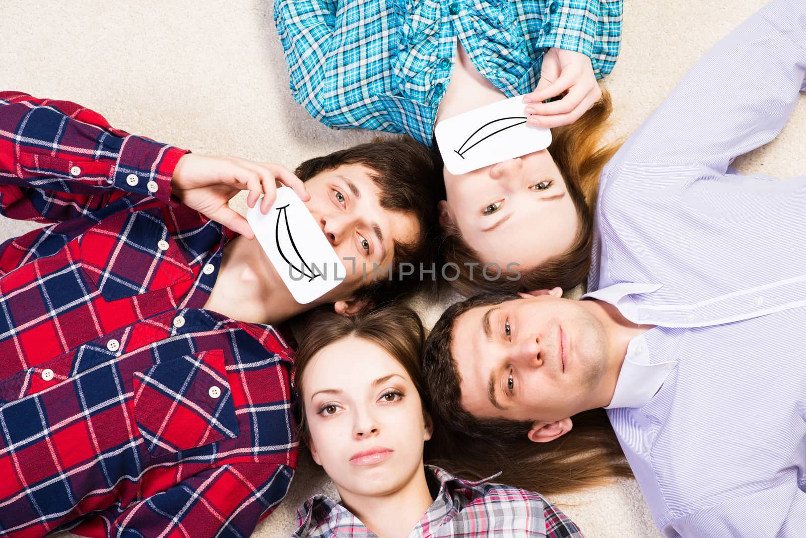 four young men lie together, applied to the face card with smiles