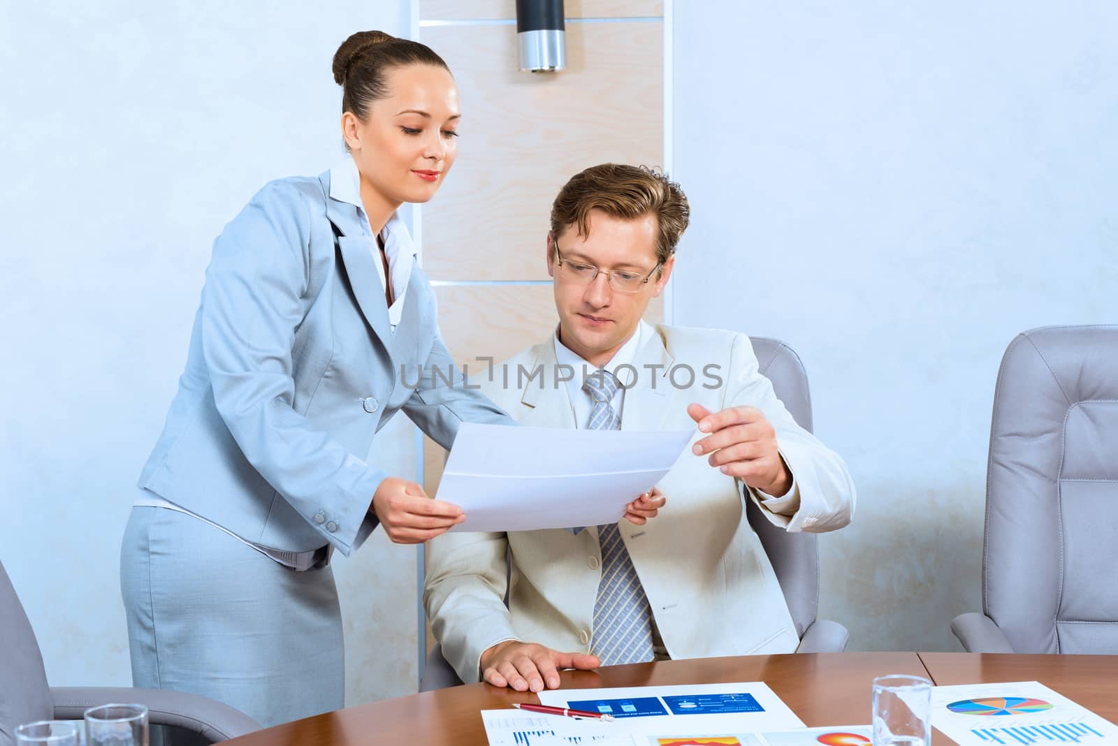 image of a two businessmen discussing documents, teamwork