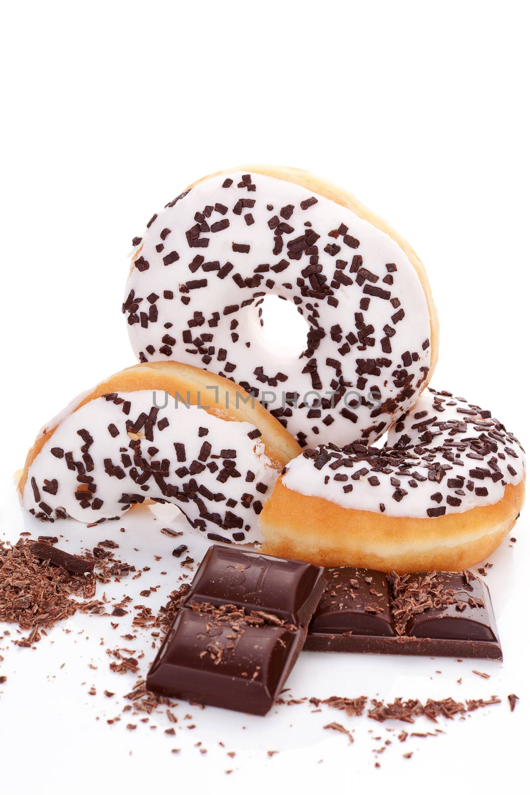 Chocolate donuts with chocolate bar isolated on white background. Delicious sweets.