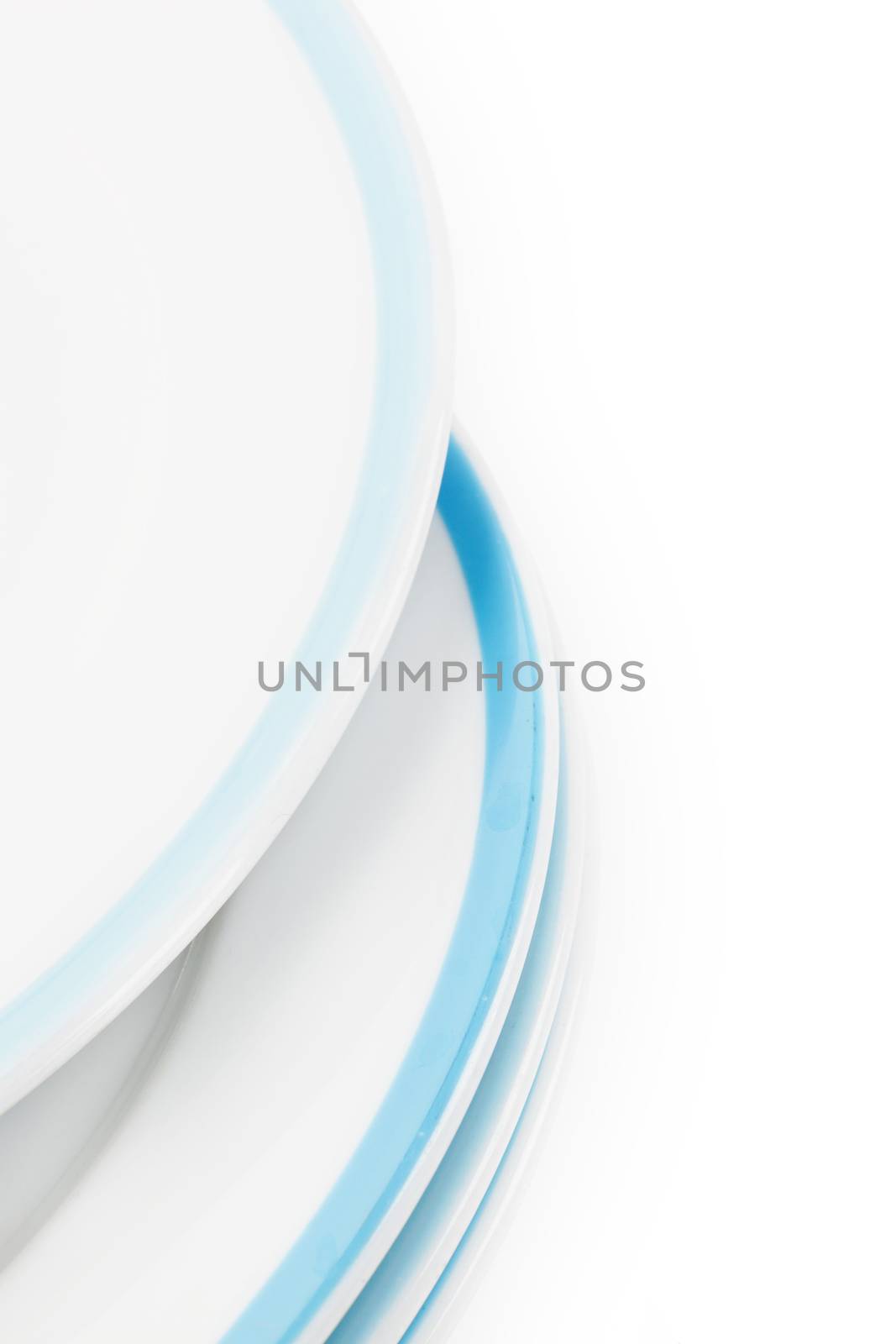 White plate with blue border detail isolated on white background with copy space for your text. Gastronomy concept. 