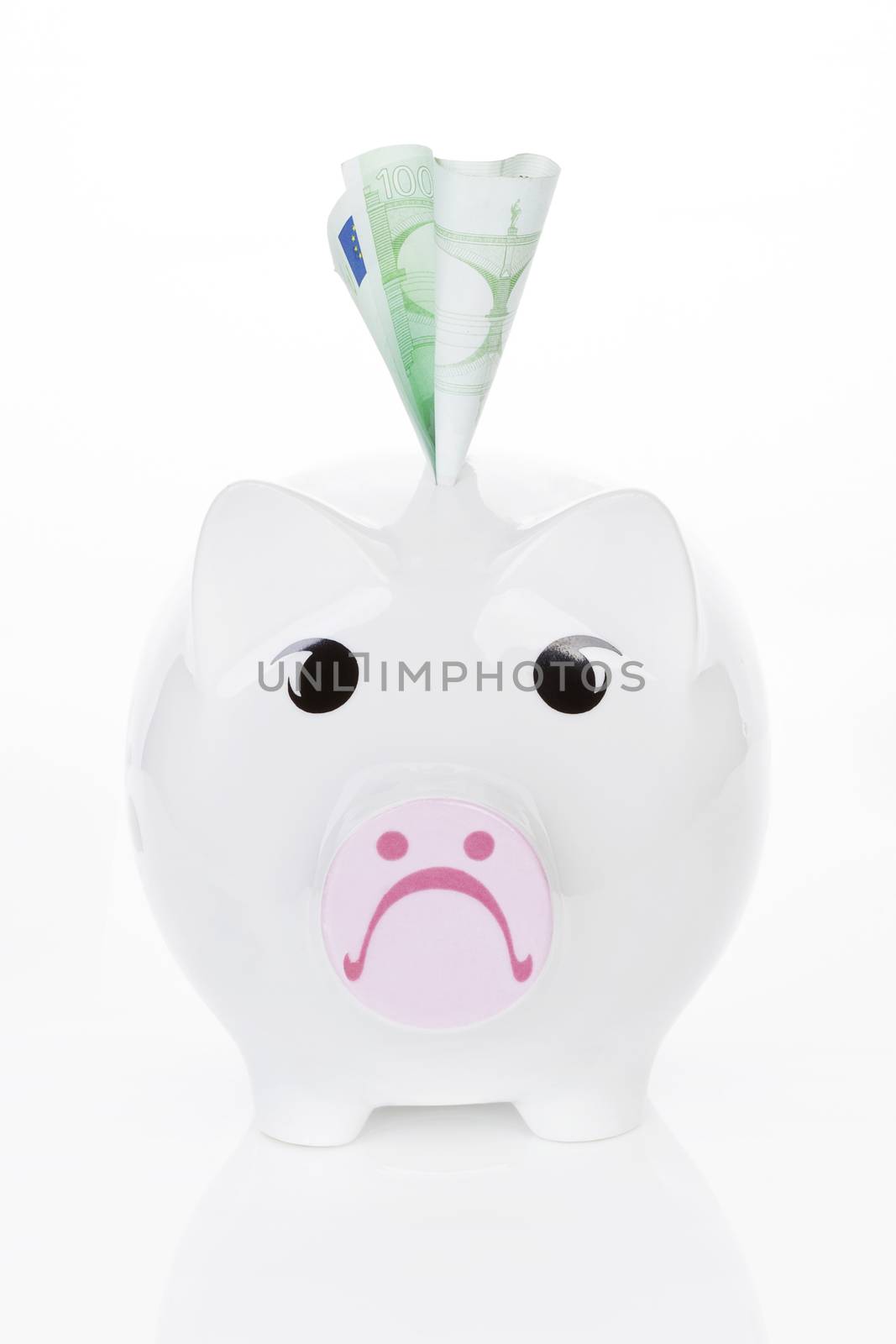 Sad piggy bank with hundred euro note isolated on white background. Savings concept.