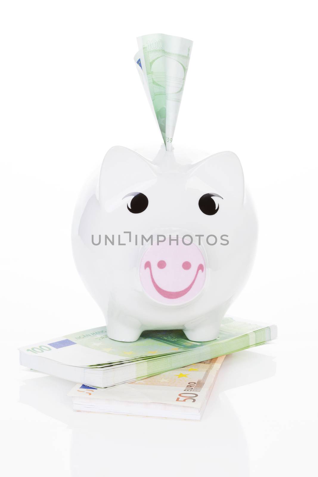 Happy piggy bank isolated. by eskymaks