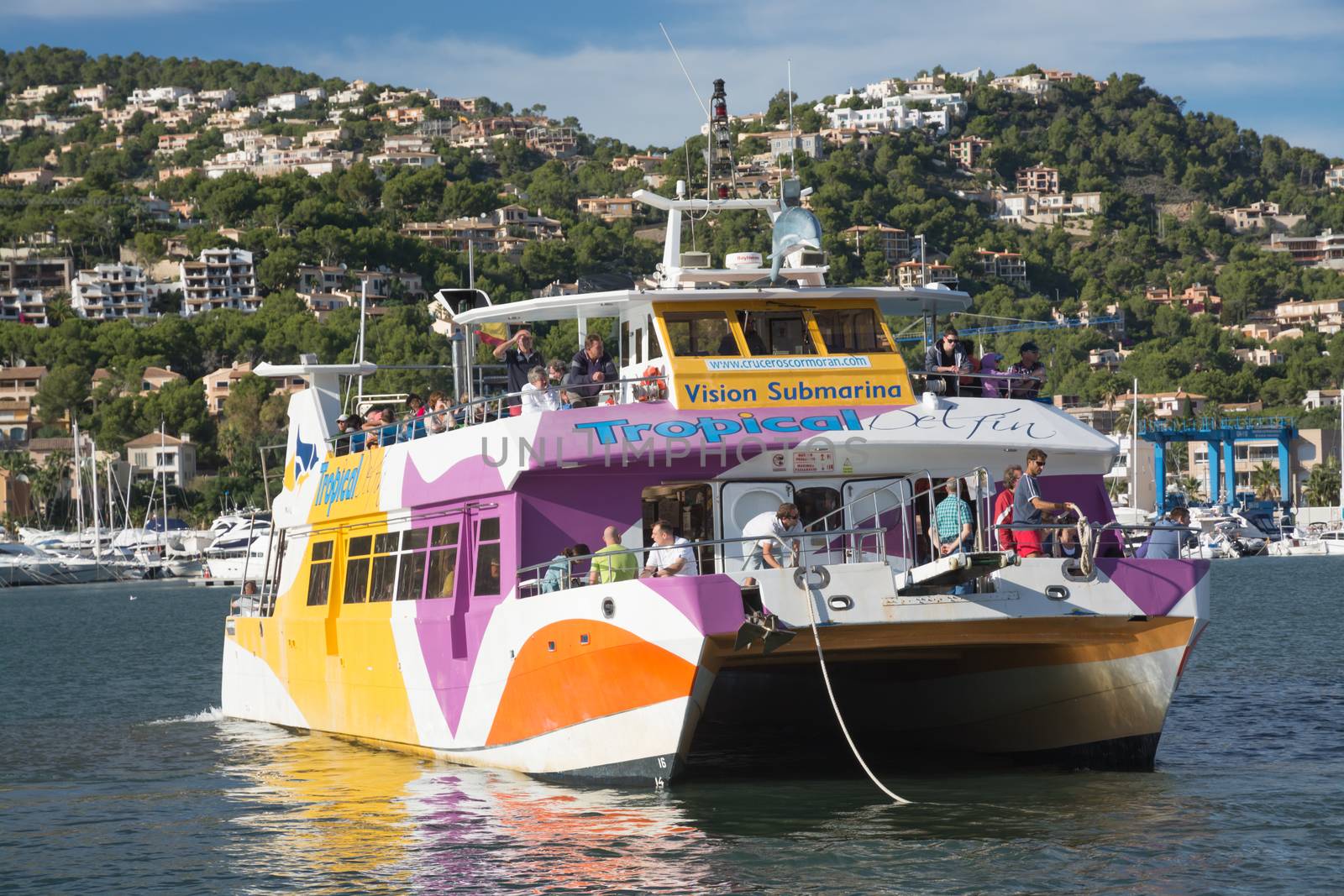 Glass bottom boat, a popular tourist attraction, arriving back in Puerto Andratx after a tour at sea.