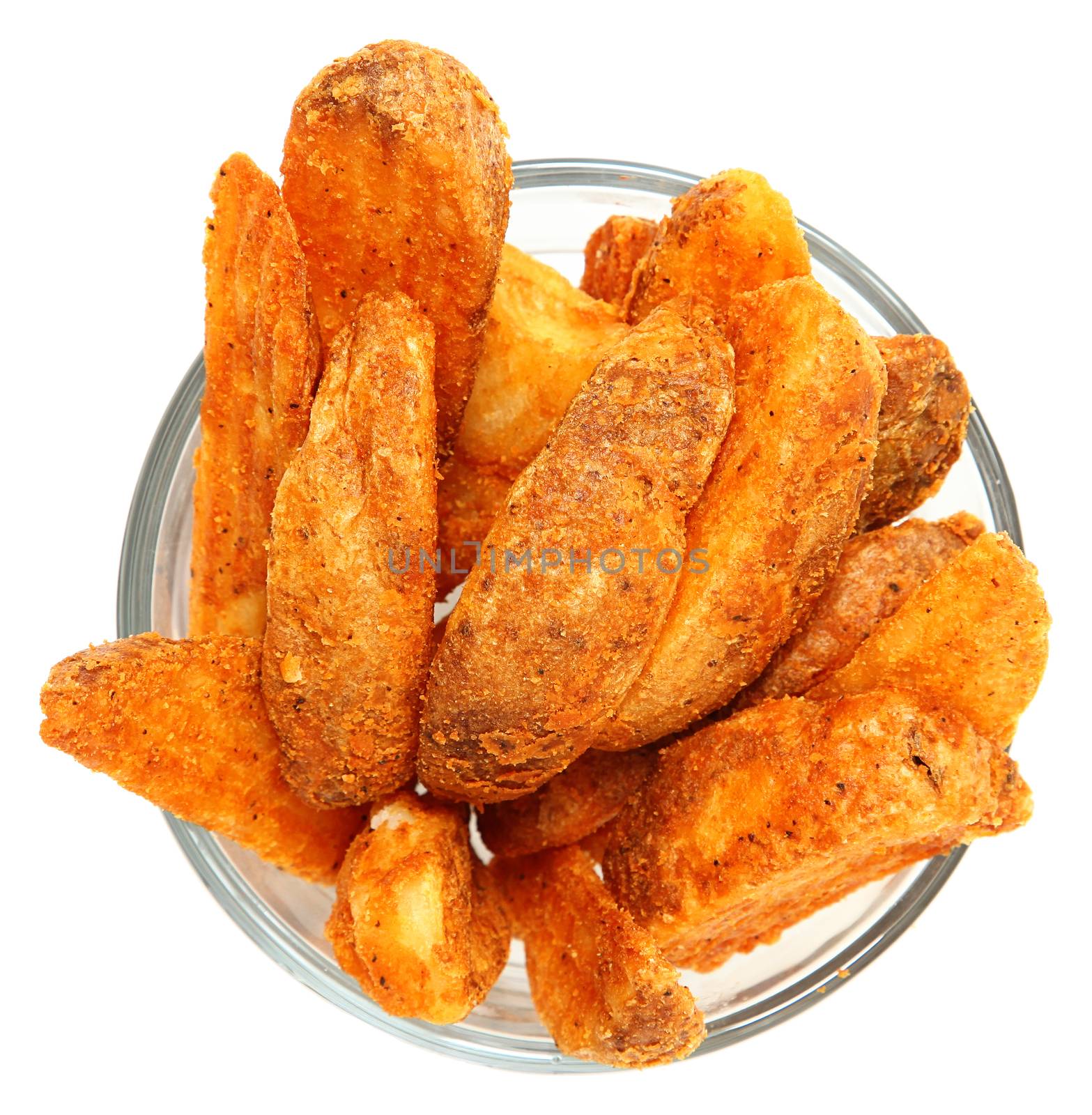 Spicy Potato Wedges in Glass Bowl Isolated Over White