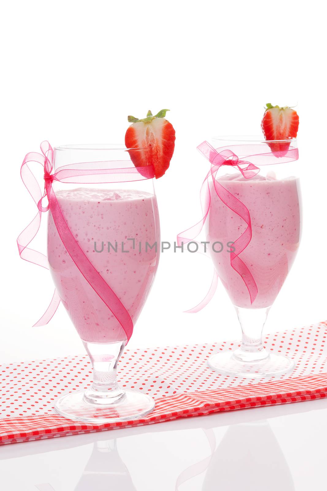 Two strawberries milk shakes. by eskymaks