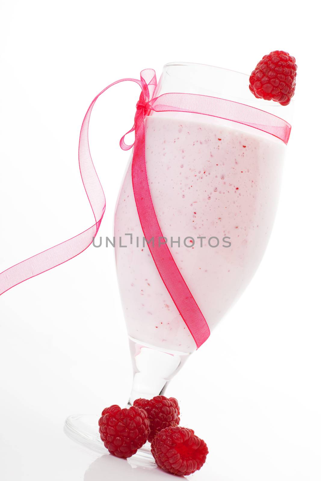 Delicious raspberry fruit shake isolated on white background. Fruity summer concept.